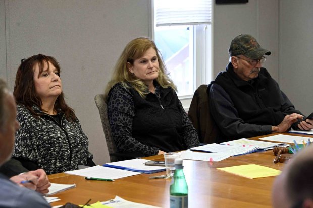 Upper Bern Township supervisors, from left, Lisabeth Lynn, chair Glorie Grim and Arthur Lambert listen to concerns about the ICE warehouse plans during the supervisors meeting on Feb. 12. (BILL UHRICH/READING EAGLE)