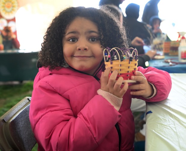 Mialasia Holland, 7, of Norristown, proudly holds the Easter basket she made during the Easter on the Farm celebration at the Pennsylvania German Cultural Heritage Center at Kutztown University on Saturday, March 28, 2026. (BILL UHRICH/READING EAGLE)