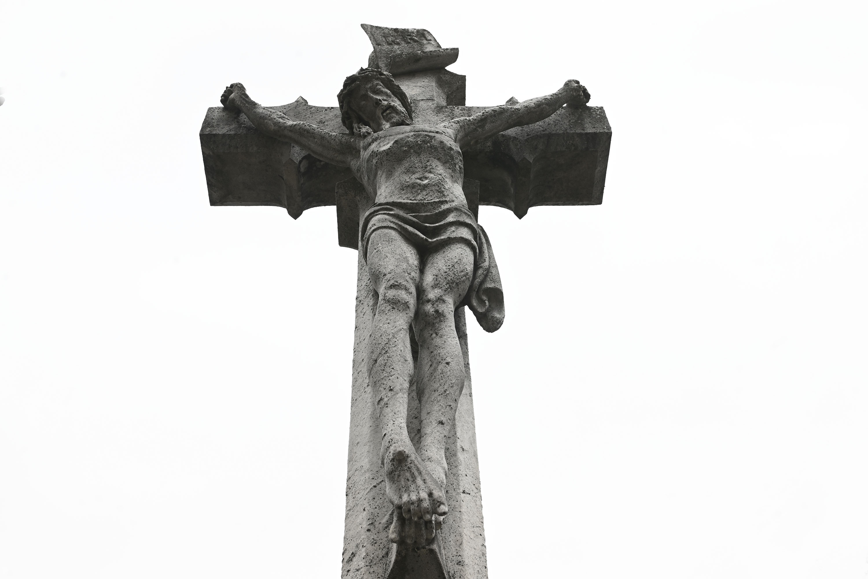 A marble crucifixion at the Heston-DeLong plot in Charles Evans...