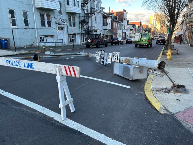 A traffic signal blocks the 1000 block of Washington Street on Tuesday morning after a strong windstorm moved through Berks County. (Bill Uhrich - Reading Eagle)