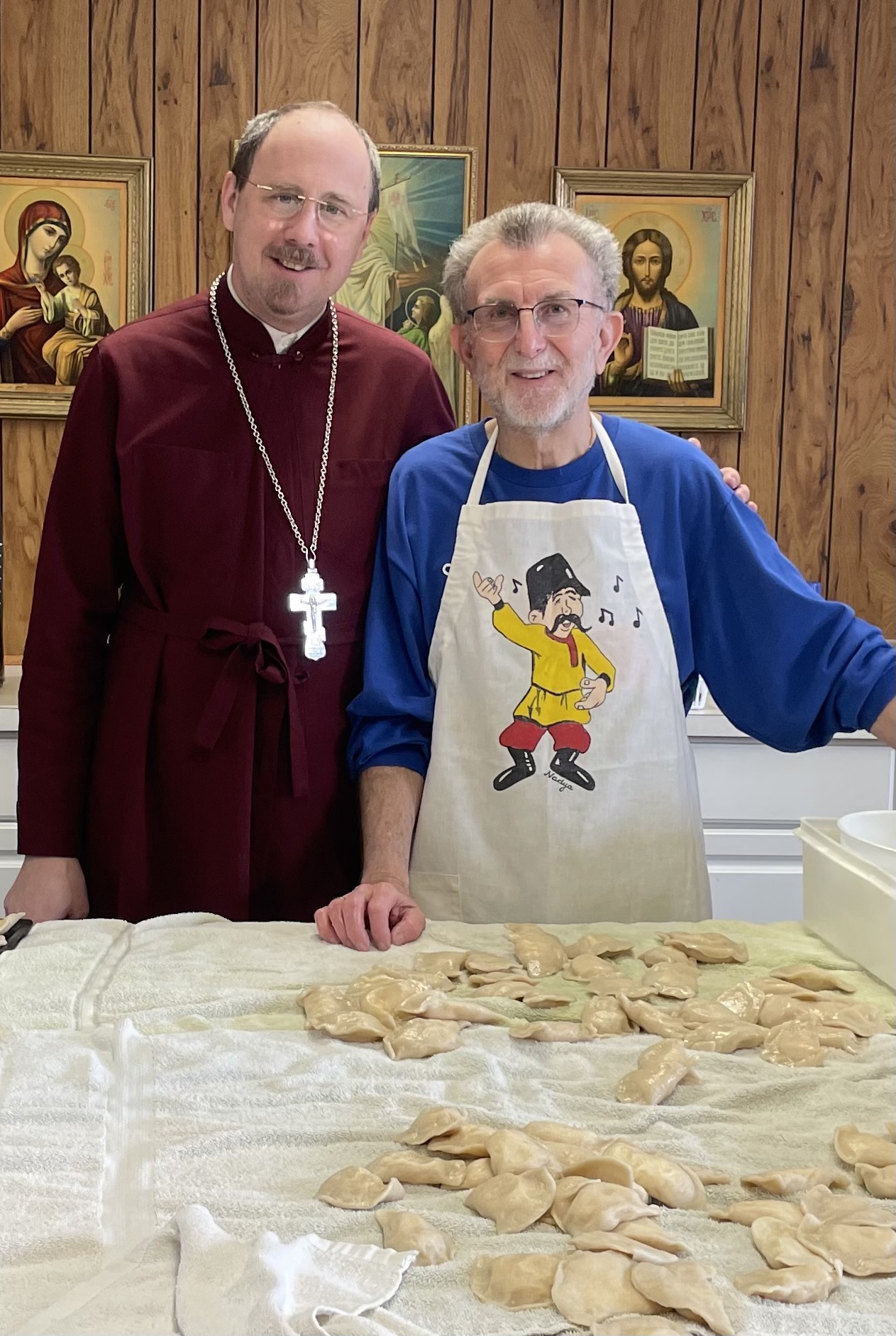 The Rev. Paul Witek, left, All Saints Orthodox Church pastor,...