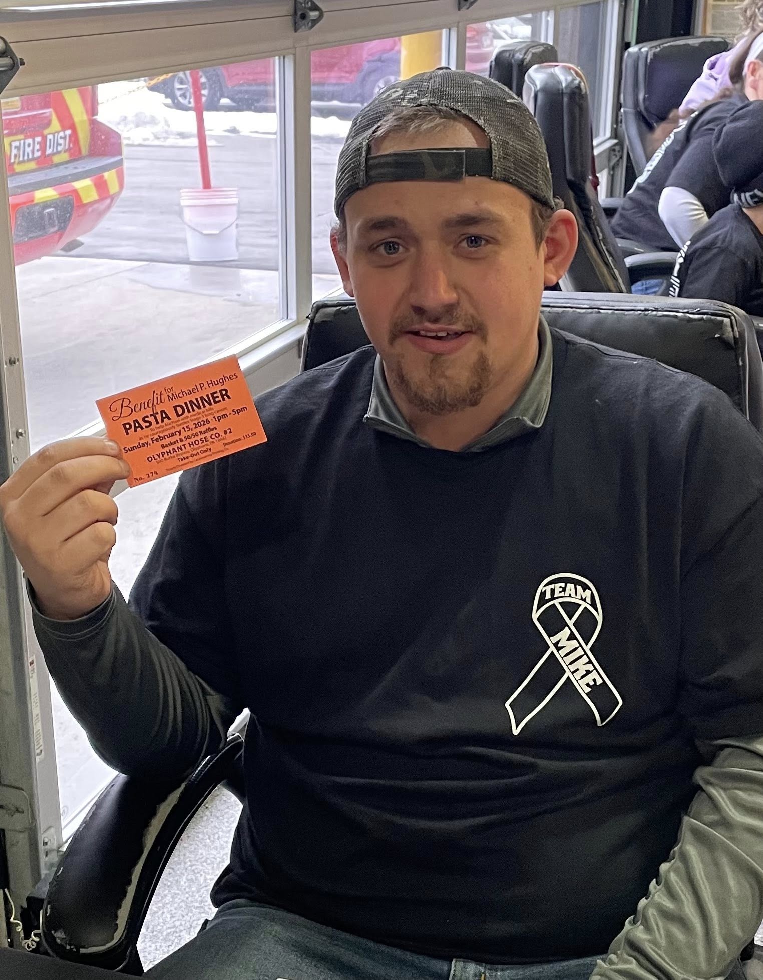 Matt Rought meets attendees as they enter Olyphant Hose Company...