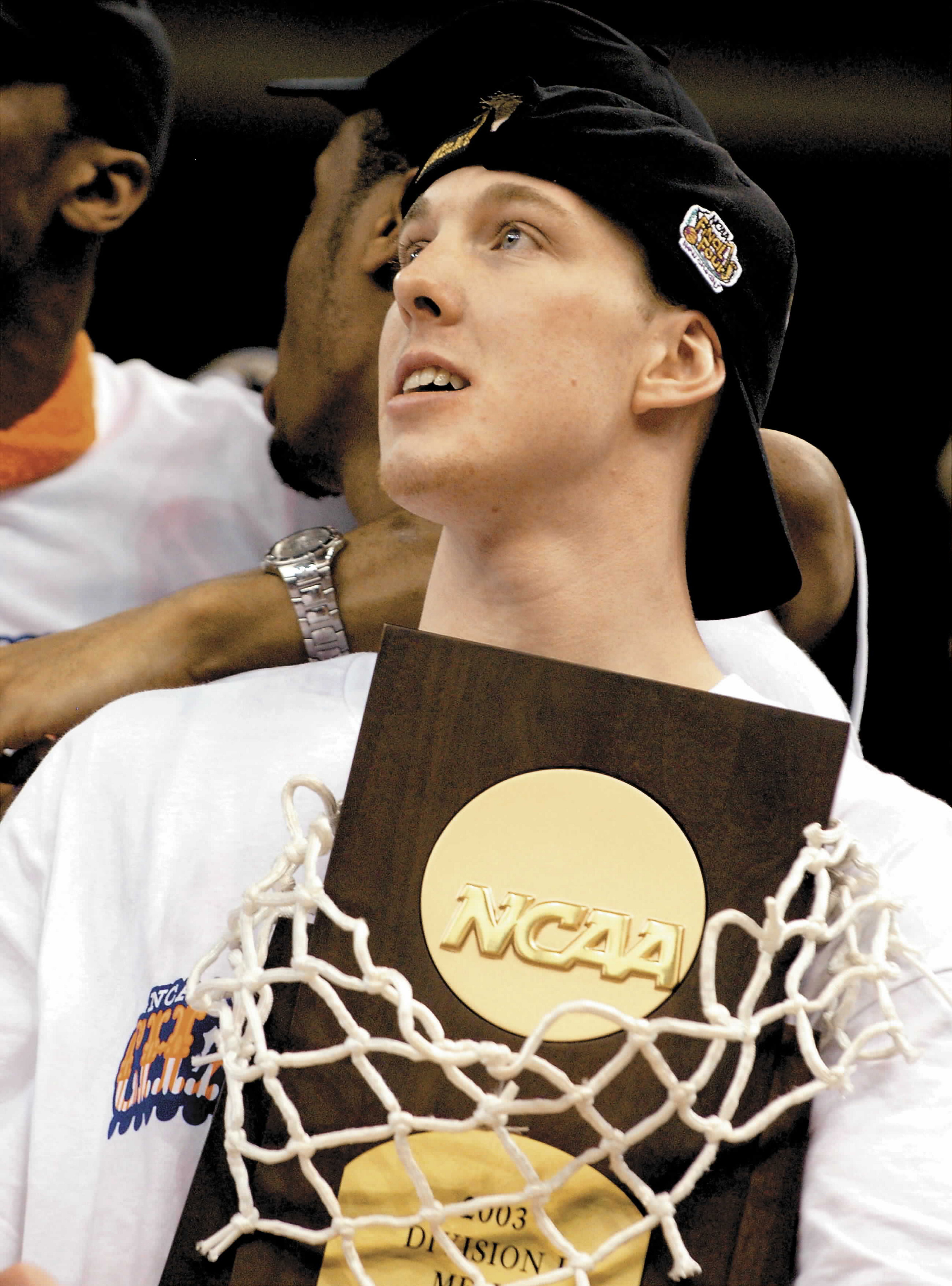 Gerry McNamara with the NCAA Men’s Basketball Championship trophy after...