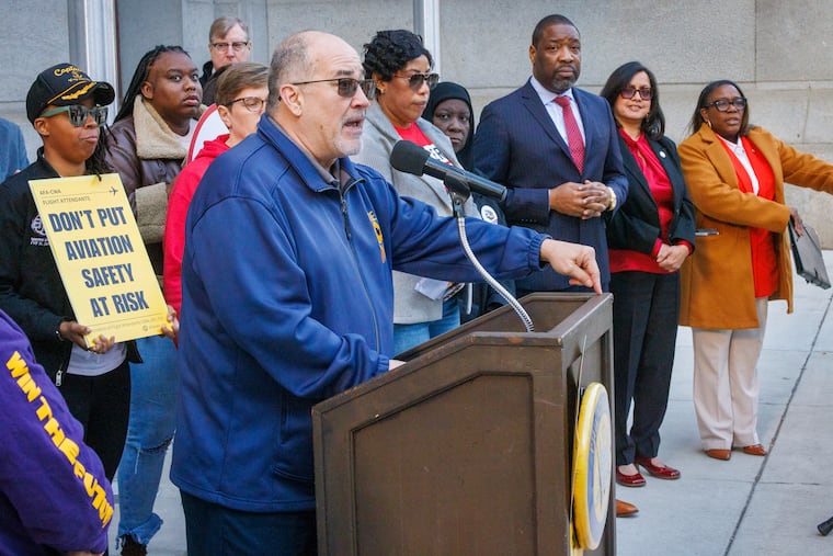 Phil Glover, national vice president of the American Federation of Government Employees, which represents TSA workers, speaks during a news conference Thursday outside City Hall. In the background, from left to right, are City Council President Kenyatta Johnson and Councilmember Nina Ahmad and Kendra Brooks.