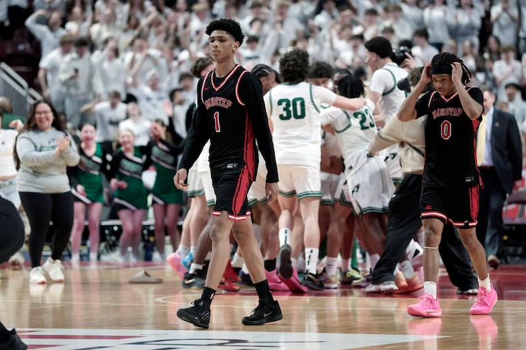 Imhotep’s # 1 Kevin Benson and # 0 Ian Smith walk off the court after the team lost the Imhotep Charter H.S. vs Central Dauphin H.S. PIAA Boys 6A Basketball Championship at the Giant Center in Hershey, Pa. on Saturday, March 21, 2026.