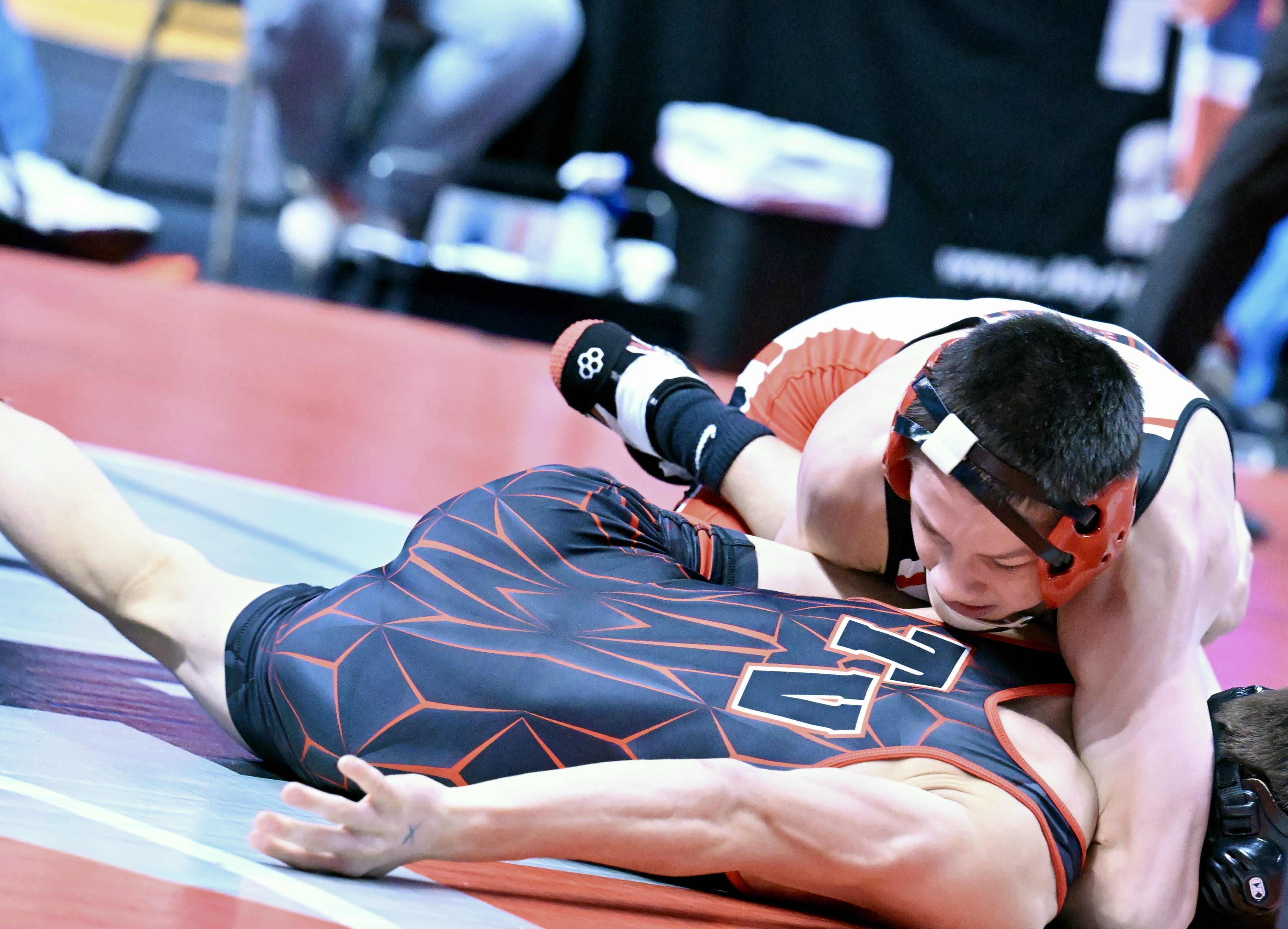 Honesdale’s Nathan Schuman, top, wrestles Tri Valley’s Owen Wolfgang in...