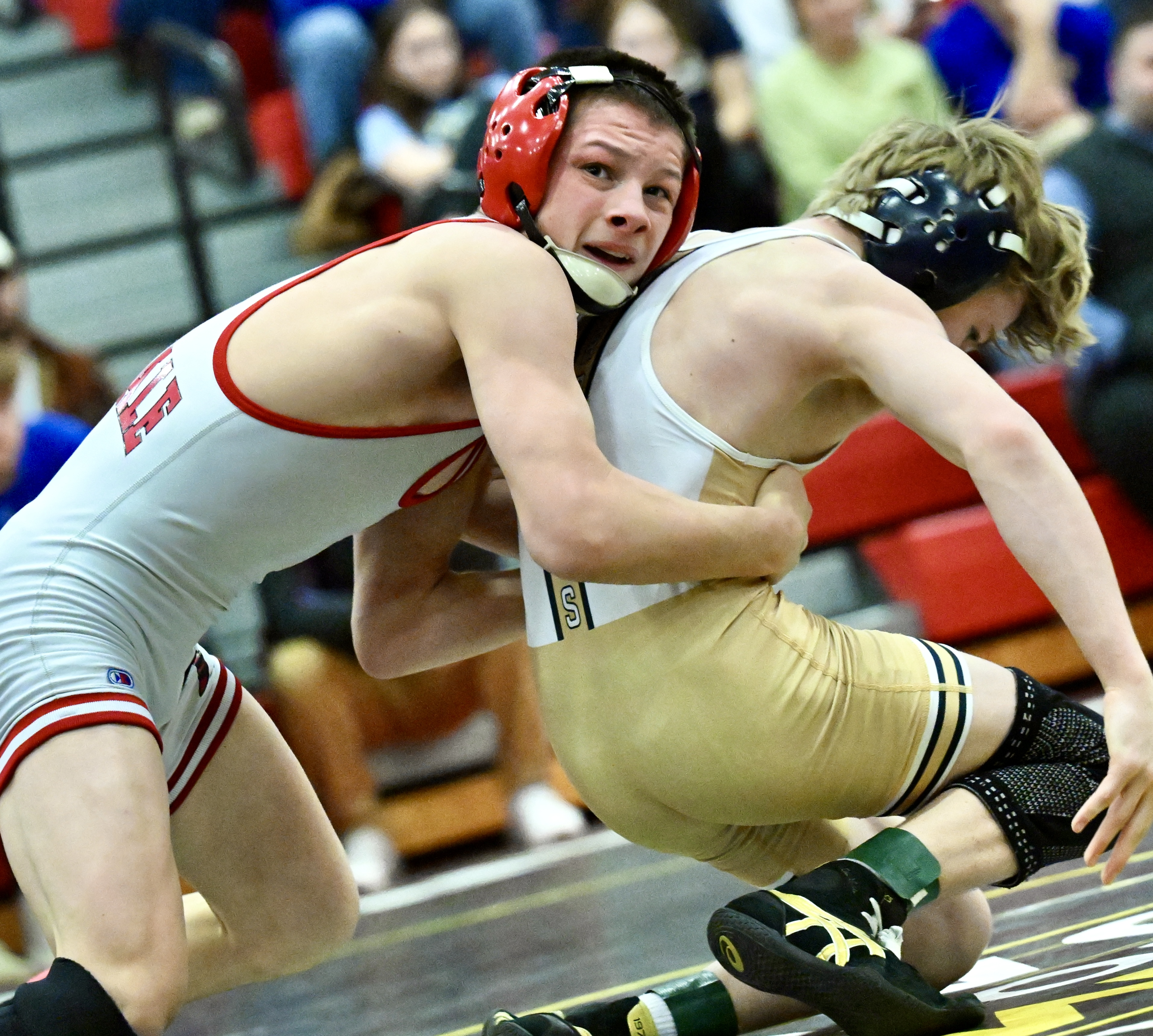 Honesdale’s Nathan Schuman, left, wrestles Montoursville’s Branden Eisenhour in the...