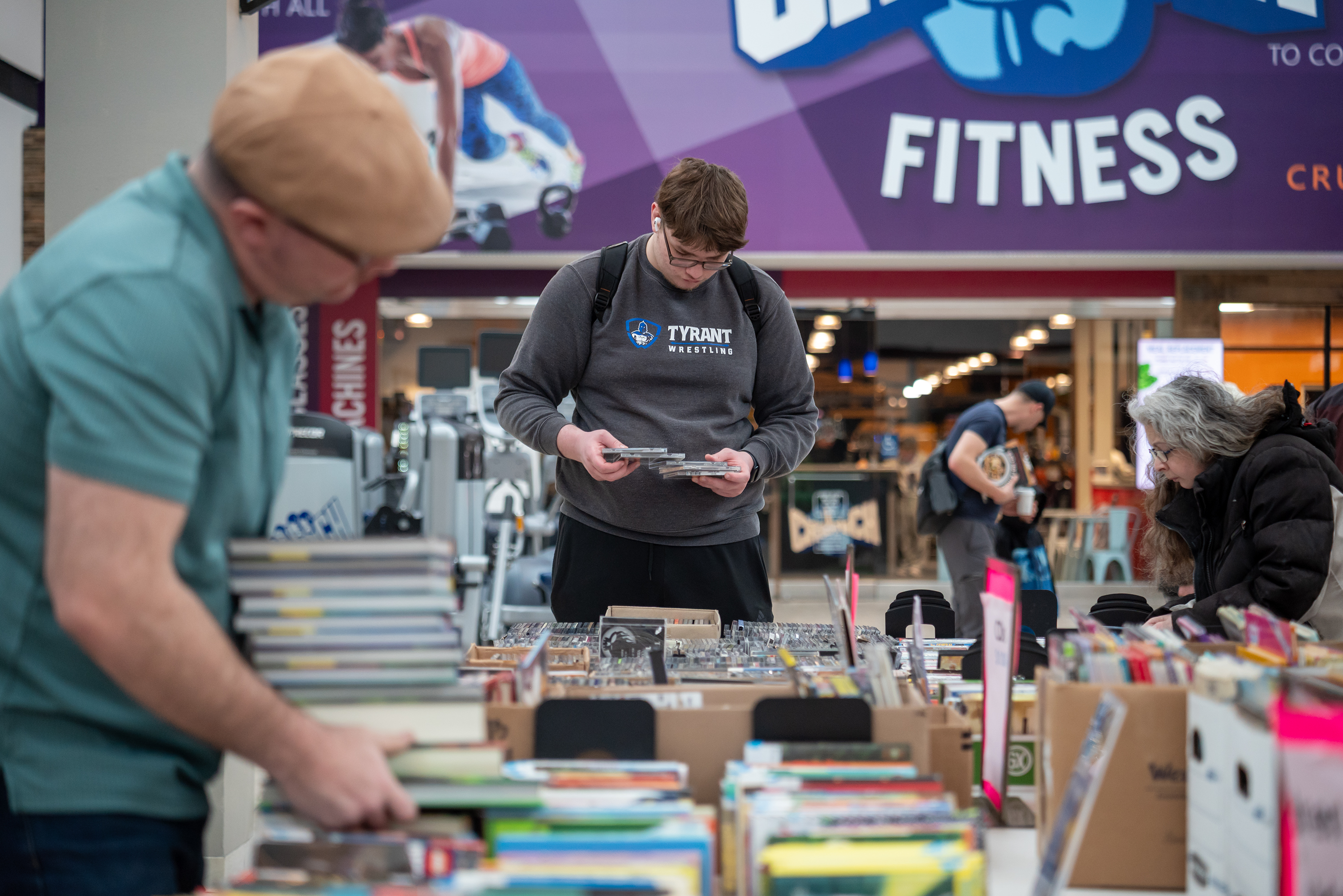 Community members look through a variety of materials for sale...