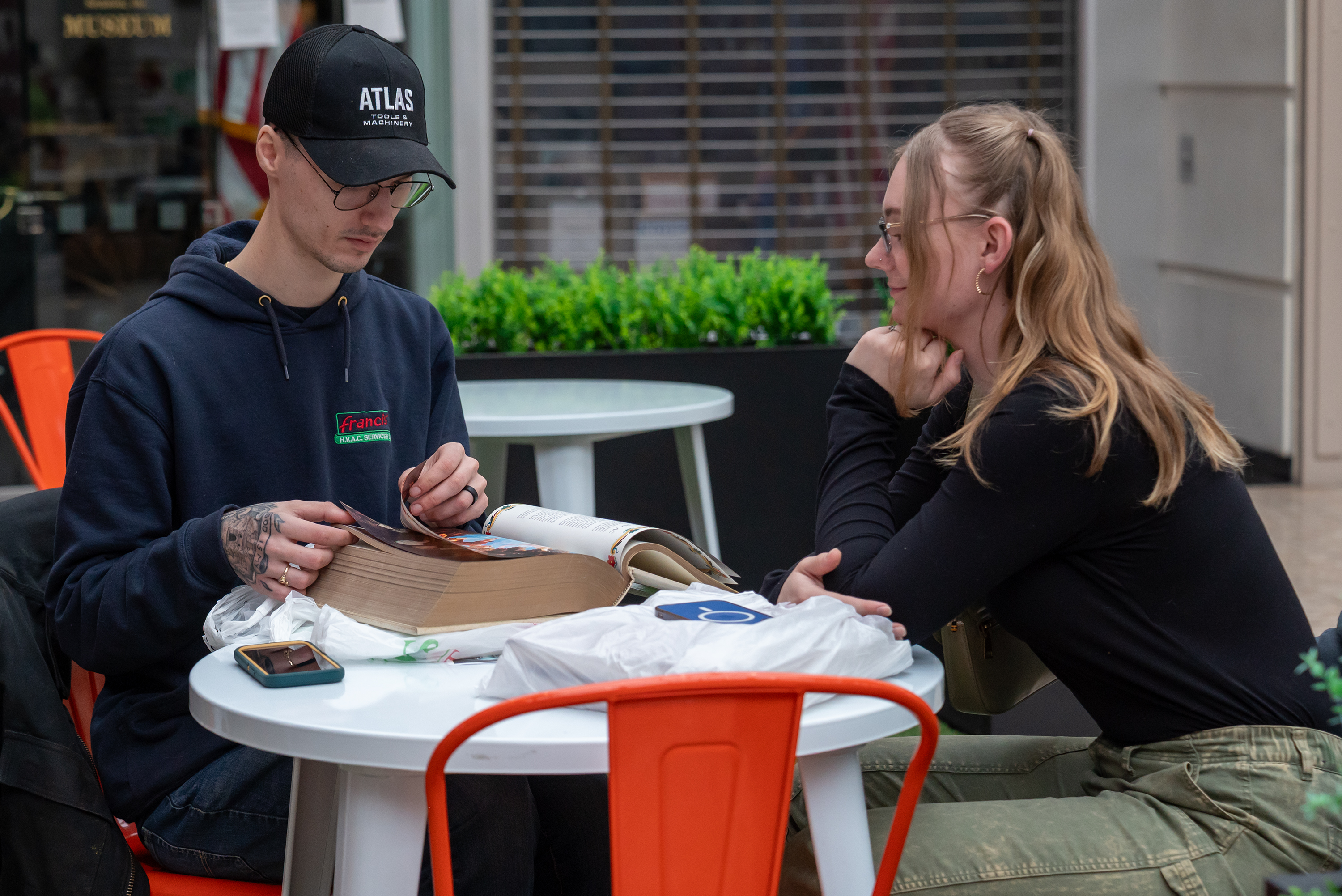 Connor Kelly and his wife Lydia Kelly look through one...