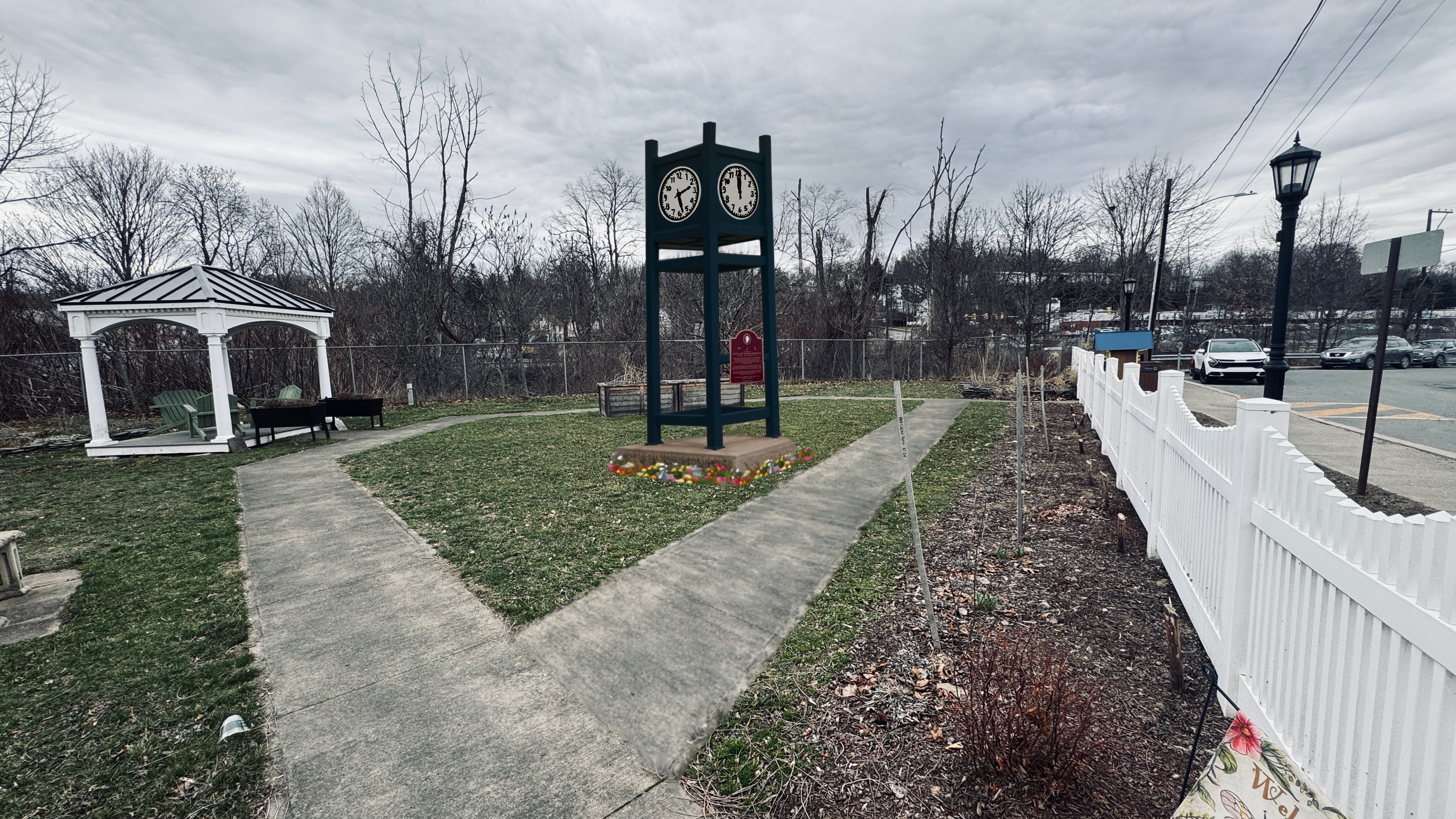 A rendering shows the clock tower and plaque dedicated to...
