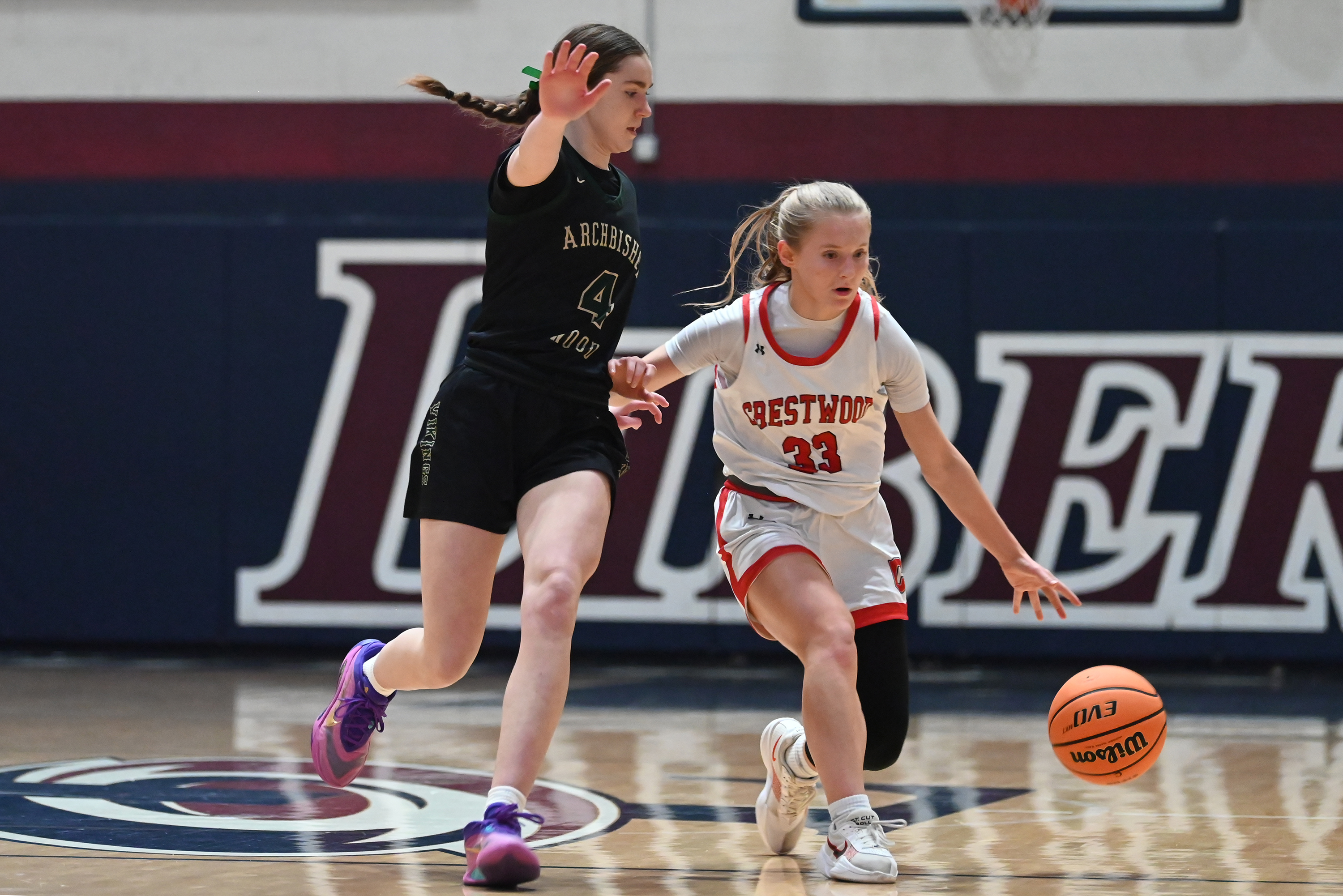 Archbishop Wood’s Addison Payne defends Crestwood’s Keira Dougherty during the...