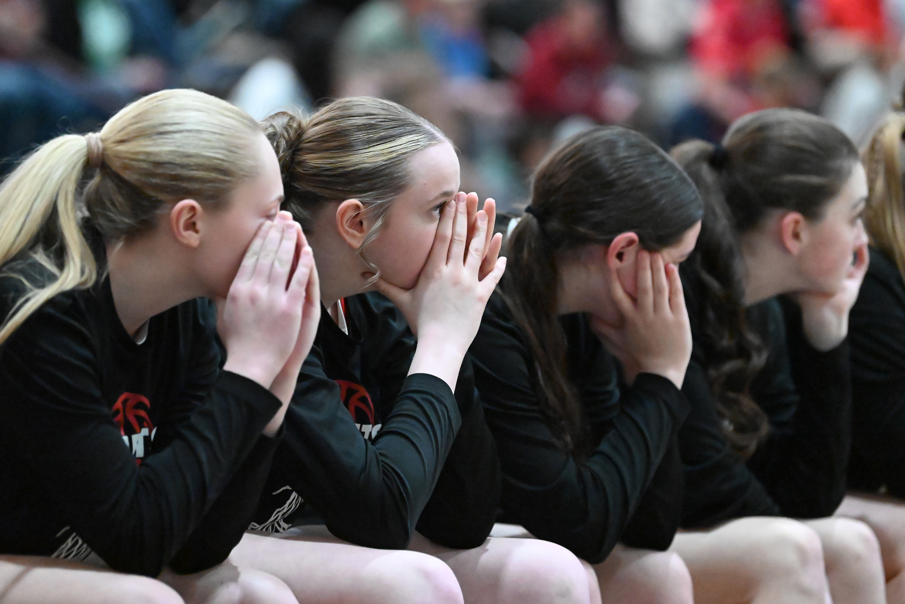 Crestwood players on the bench watch game play during the...