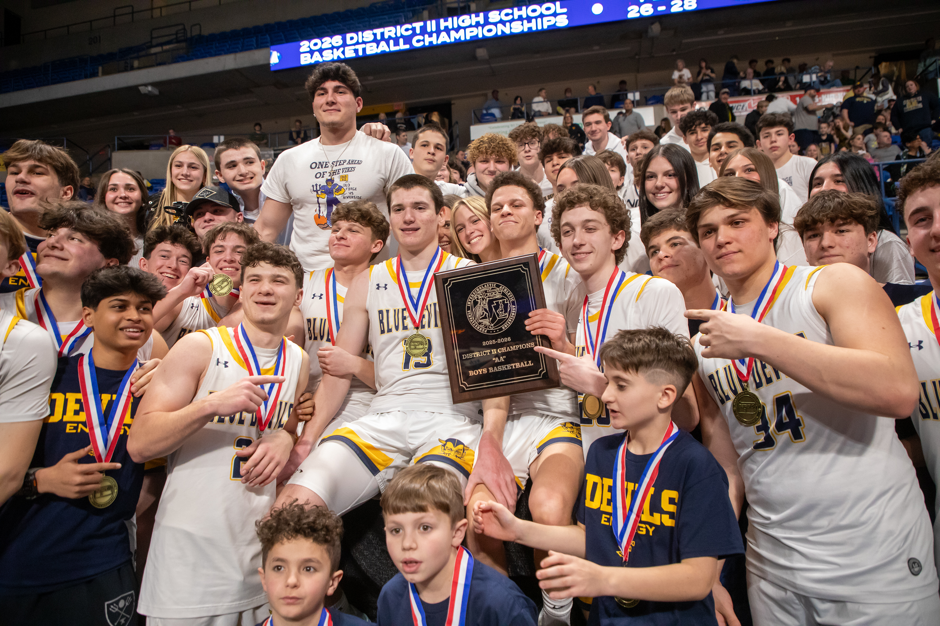 Old Forge poses with their student section after winning the...