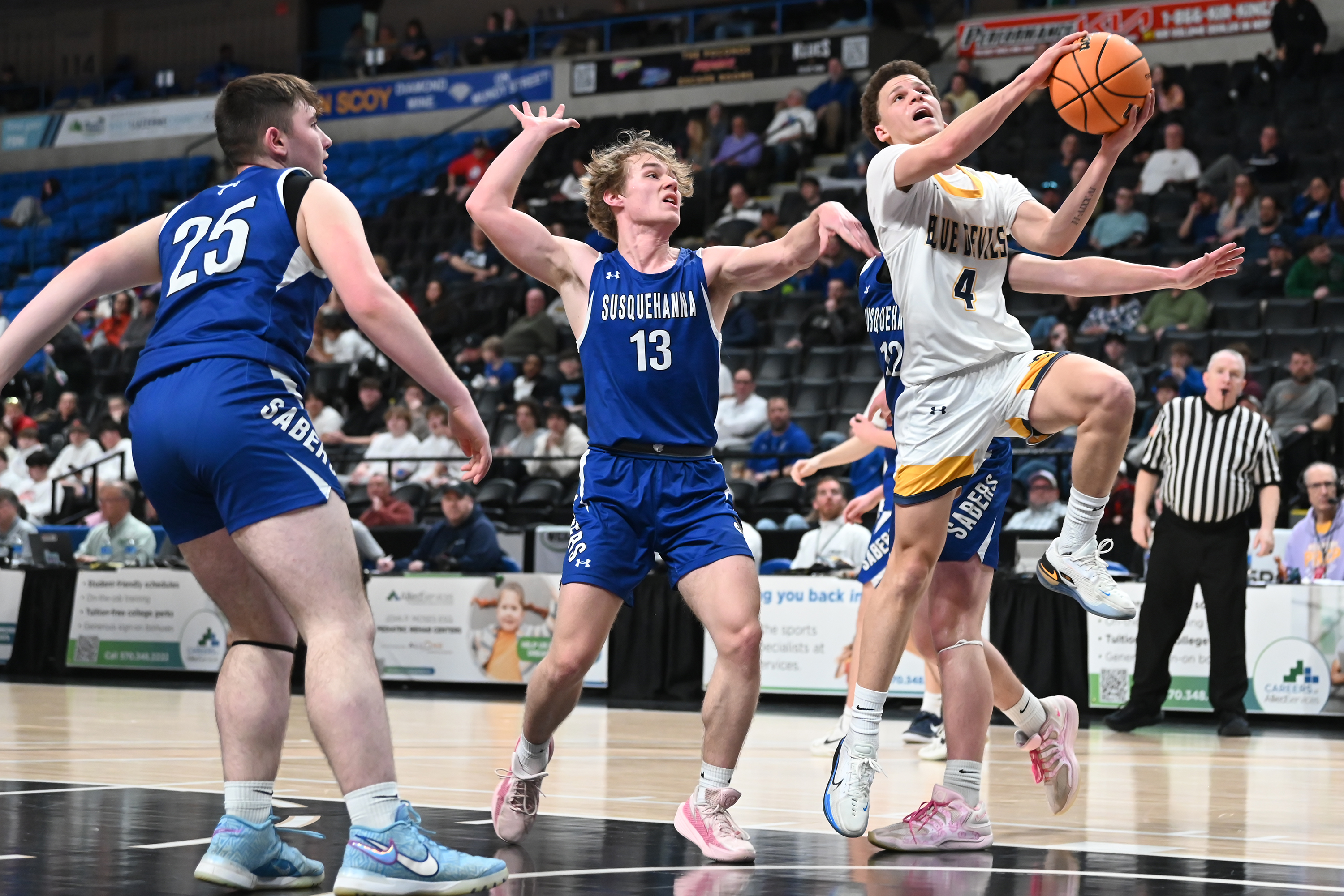 Susquehanna’s Preston Wolf defends Old Forge’s Cameron Parker during the...