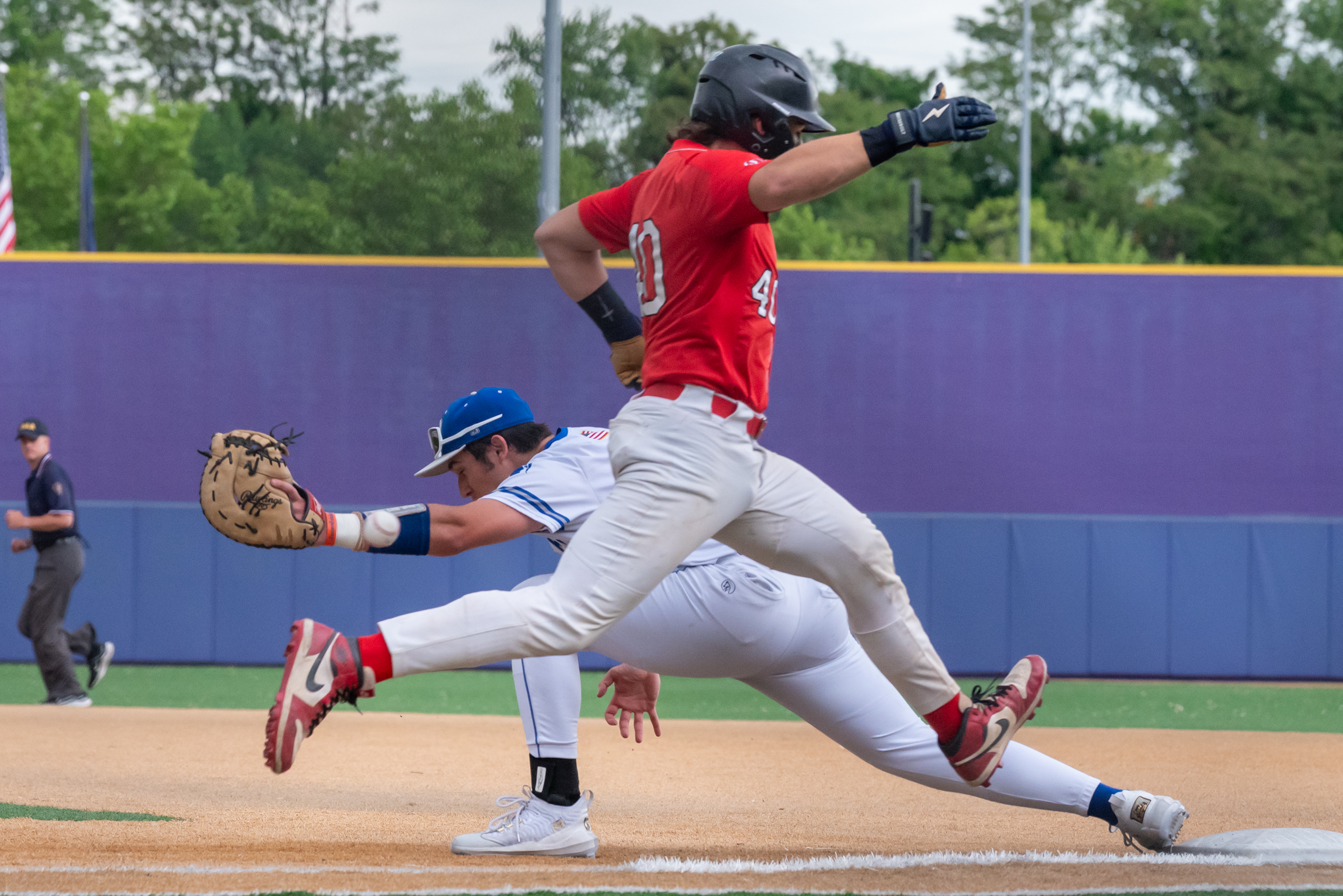 Mid Valley’s Nick Mills stretches to catch the ball before...