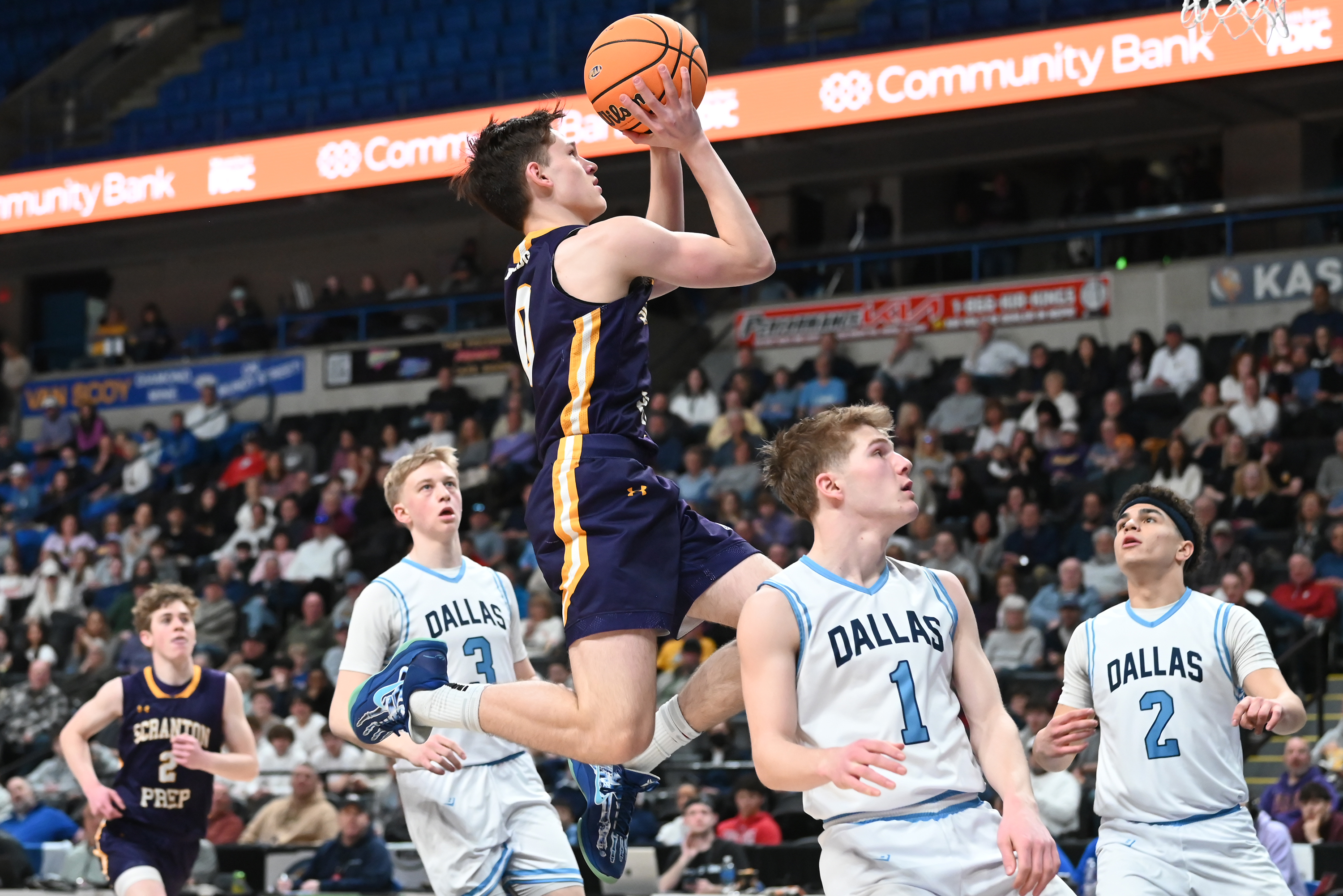 Scranton Prep’s Chicky Skoff leaps towards the hoop during the...