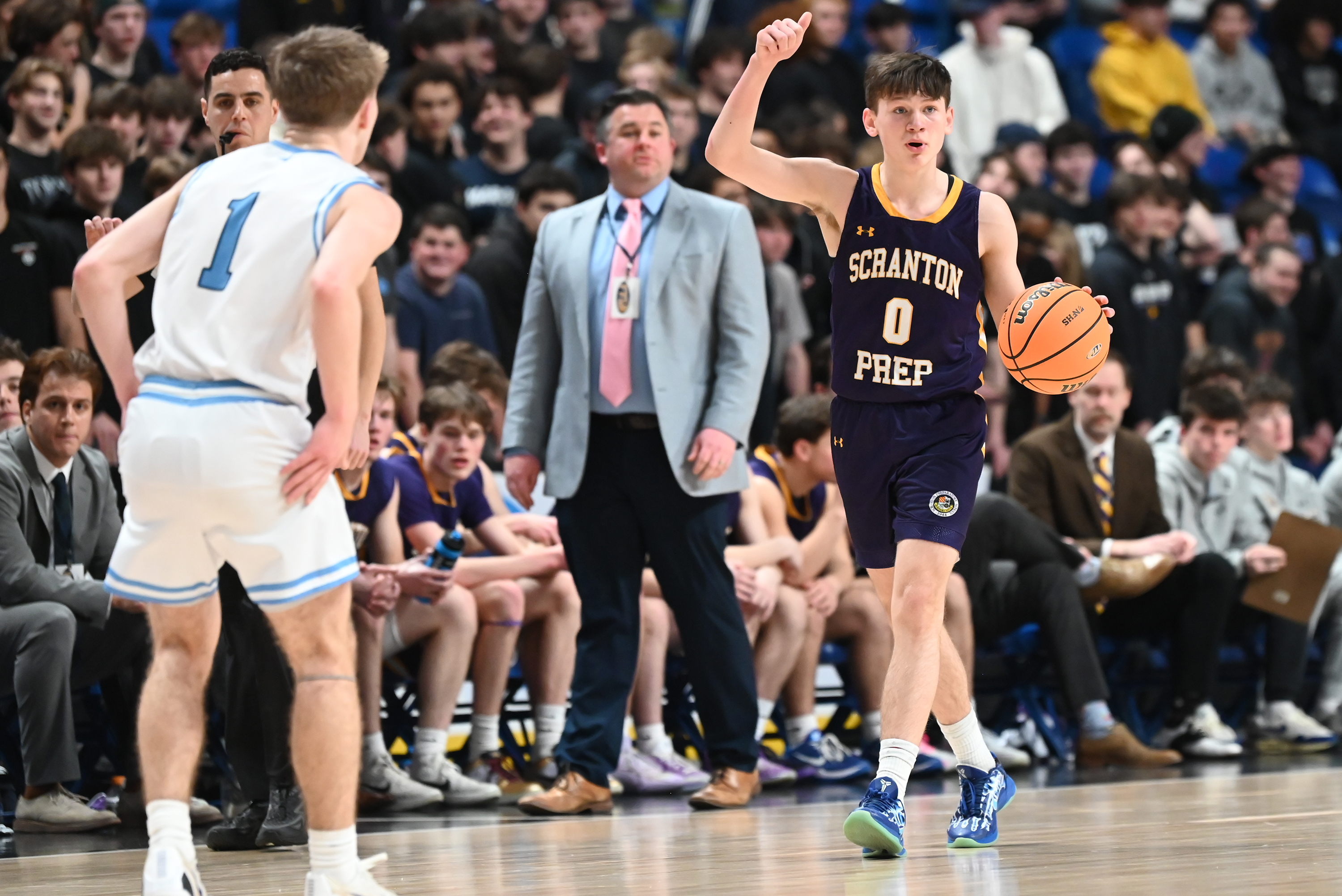 Scranton Prep’s Chicky Skoff signals to his teammates during the...