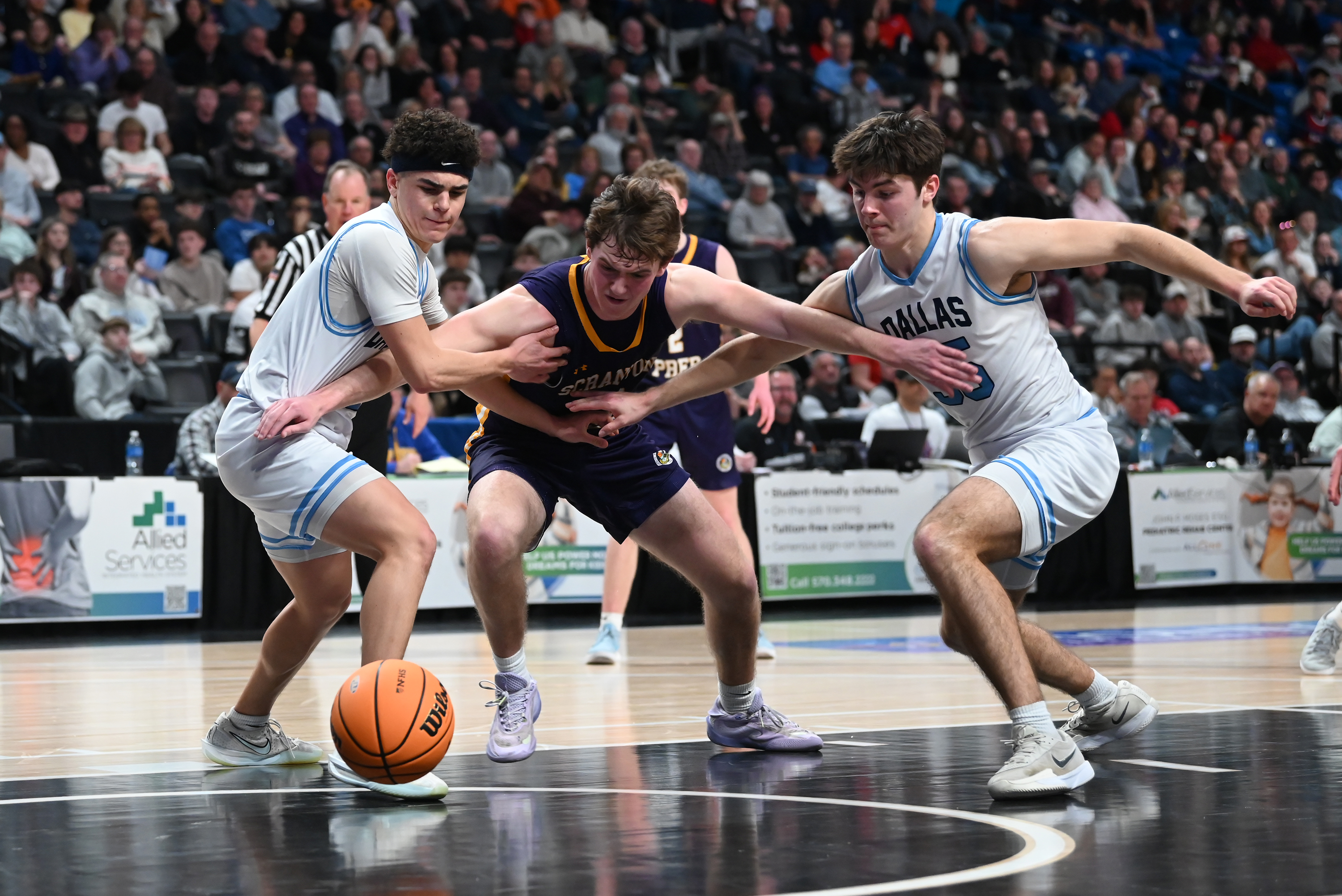 Scranton Prep’s Liam Haggerty holds off Dallas’ Tyce Mason and...