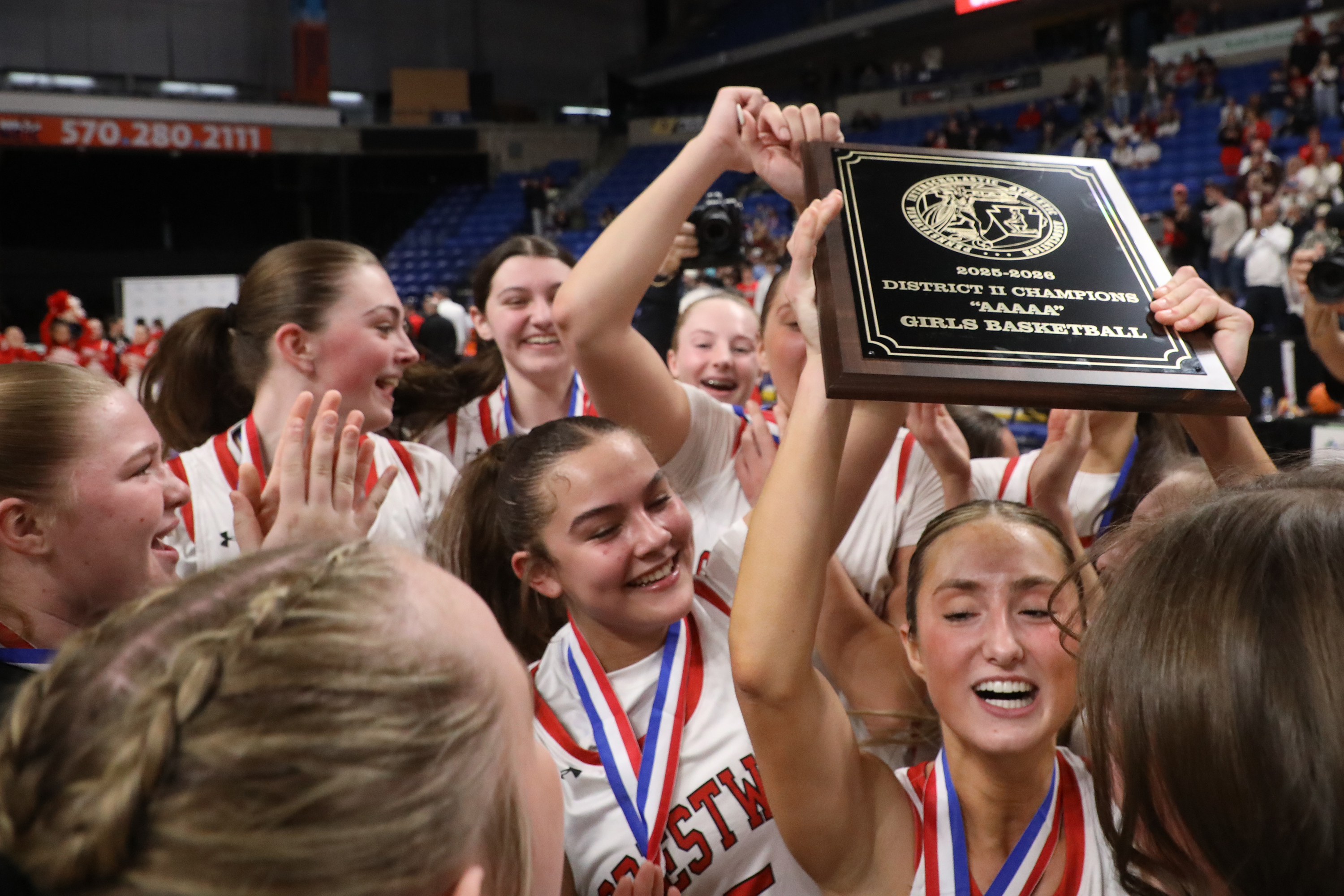 Crestwood players celebrate with their championship plaque after the District...