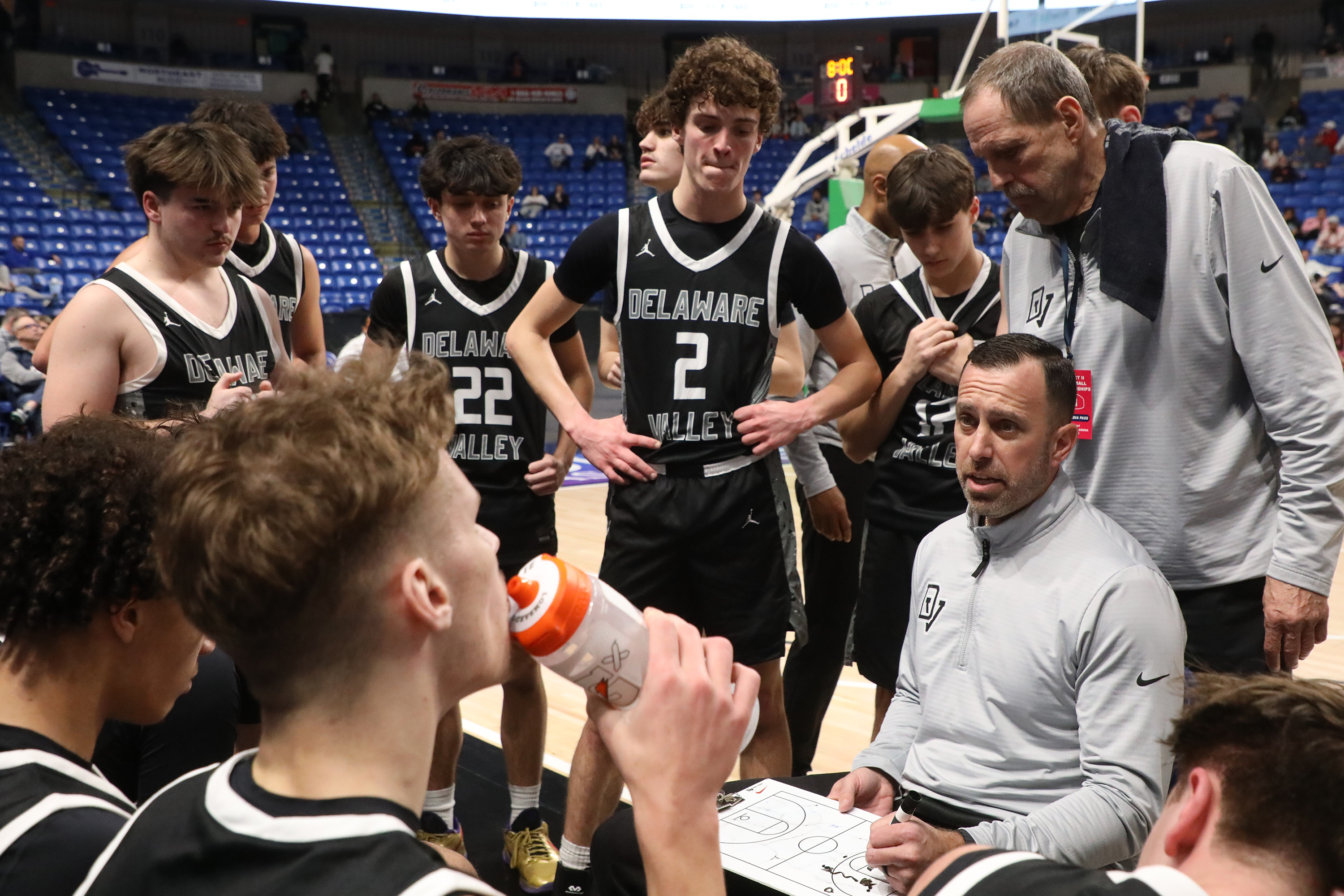 Delaware Valley’s head coach Kris Holtzer talks to his players...