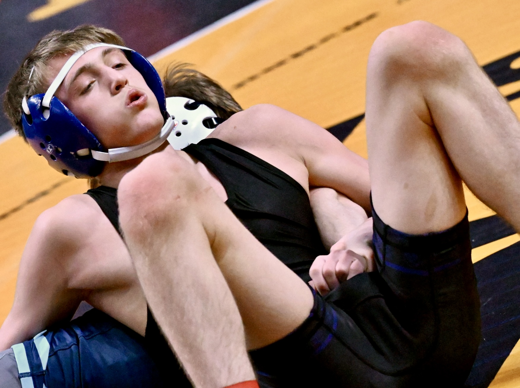 Hanover Area’s C.J. Caines wrestles Burrell’s Cameron Baker in the...