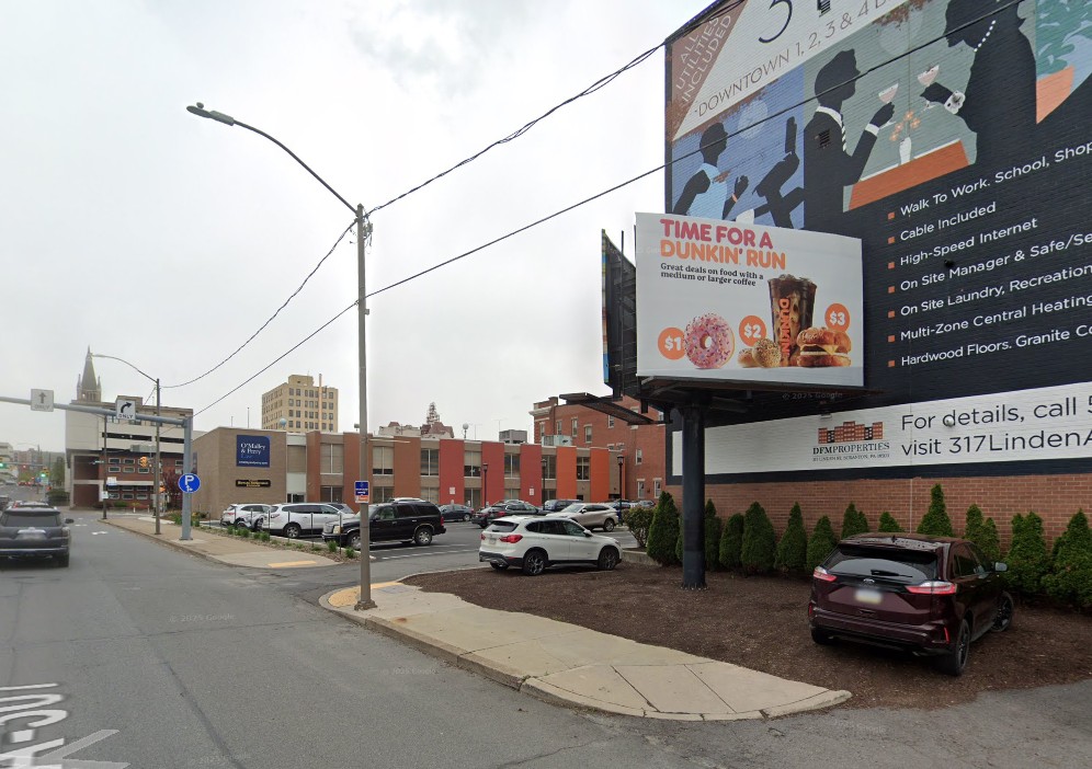 A billboard with a Dunkin’ ad at 320 Mulberry St....