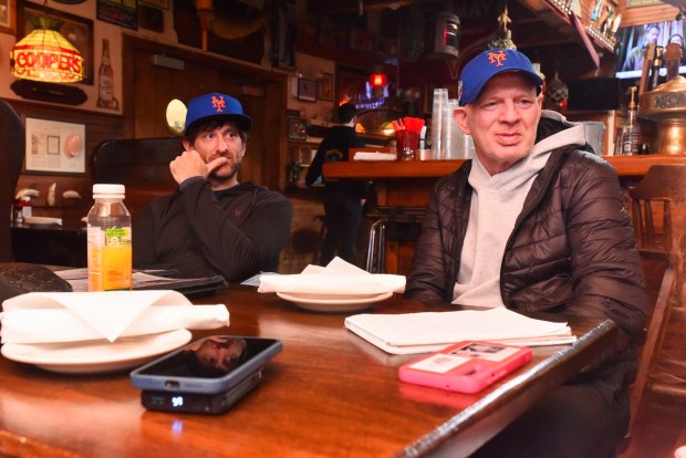 Dennis D'Augostine, lead pastor of Steamtown Church, and former professional baseball player Lenny Dykstra sit at a table in Cooper's Seafood House in Scranton Friday, March 27, 2026. (SEAN MCKEAG / STAFF PHOTOGRAPHER)