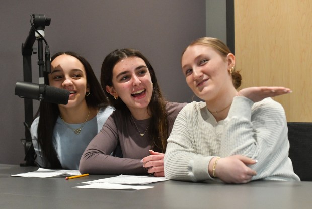 Old Forge eighth-grade students Chiara Johnson, Annabella DiGregorio, Maddison Pezzuti, present their ideas on camera during an entrepreneurial workshop at the University of Scranton's IDEA Center in Weiss Hall on the Scranton campus Thursday, March 19, 2026. (SEAN MCKEAG / STAFF PHOTOGRAPHER)