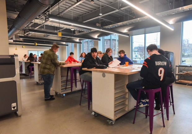 Old Forge eighth-grade students collaborate during an entrepreneurial workshop at the University of Scranton's IDEA Center in Weiss Hall on the Scranton campus Thursday, March 19, 2026. (SEAN MCKEAG / STAFF PHOTOGRAPHER)