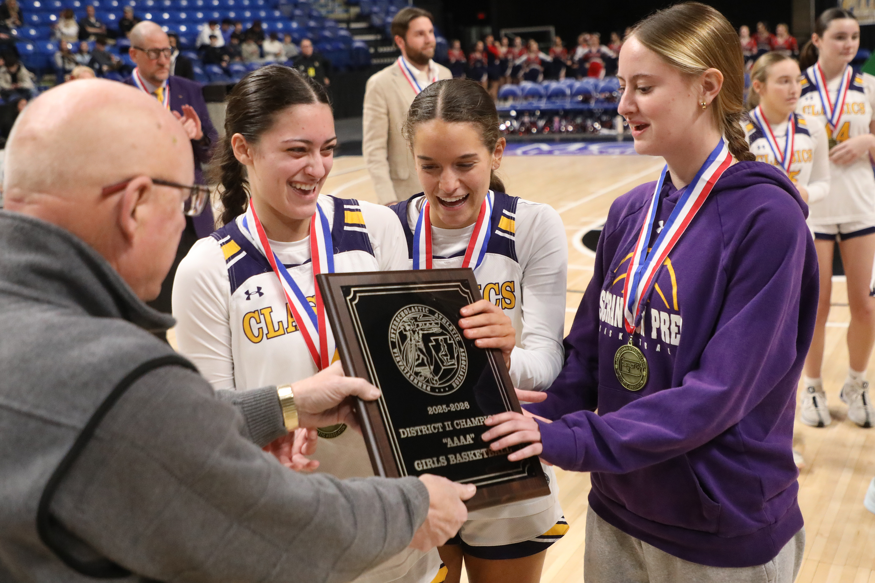 Scranton Prep’s Ava Fenton (4), McKenna Toolan (23), and Maeve...