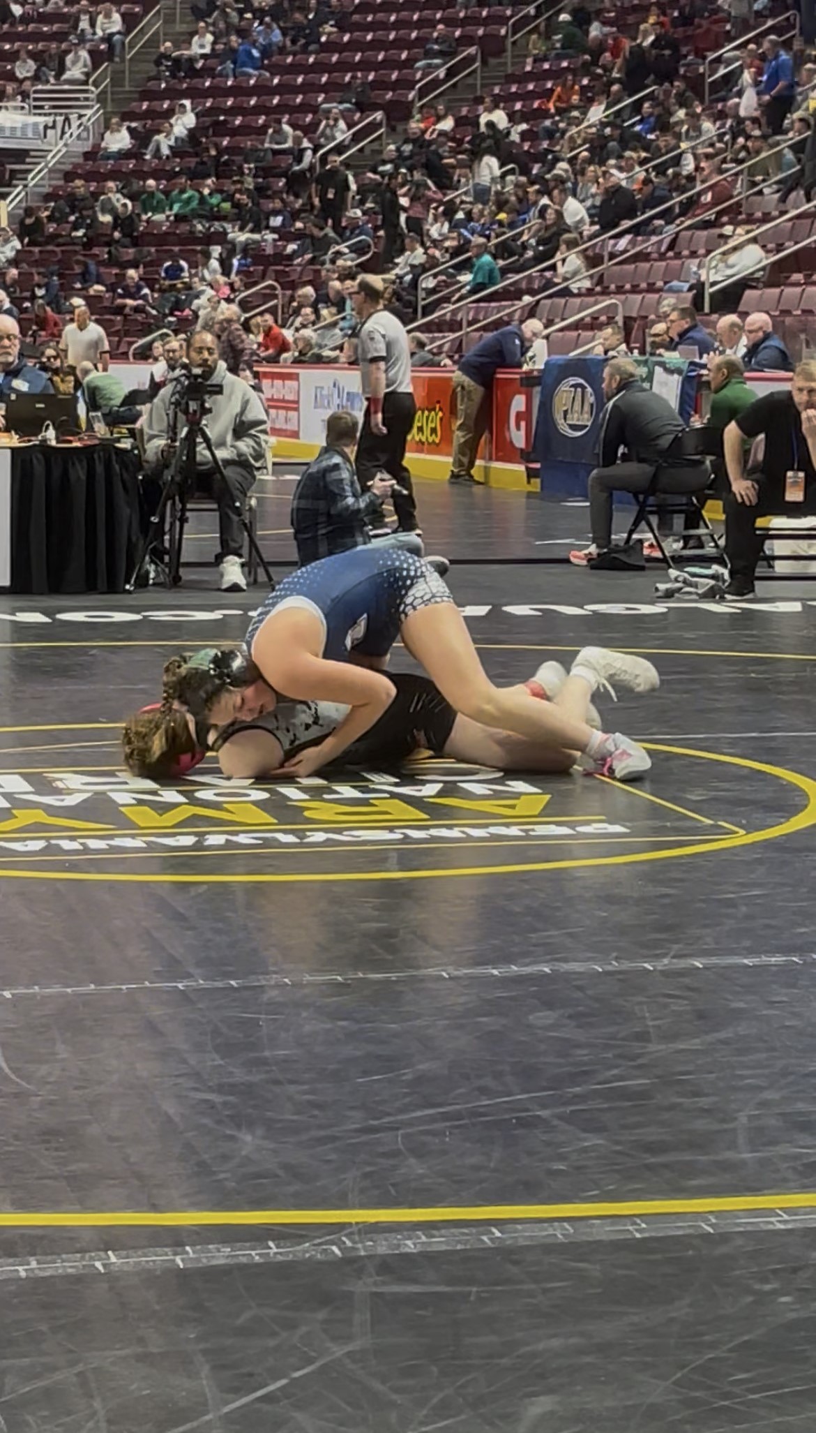 Abington Heights’ Hayden Manning, top, wrestles Cumberland Valley’s Emma Beaven...
