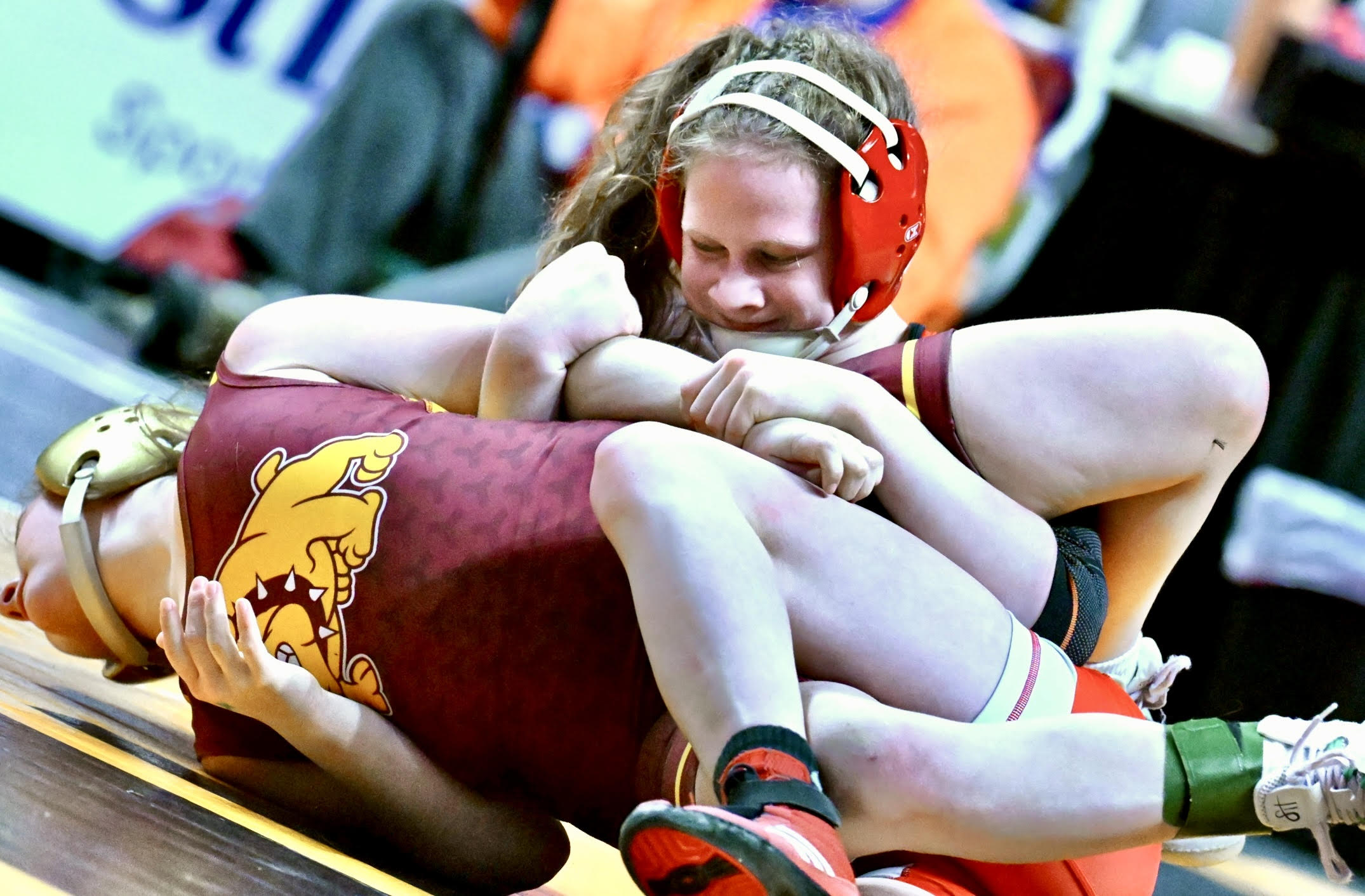 Lackawanna Trail’s Cidney Schaffer, back, wrestles Big Spring’s Charlotte Barrick...