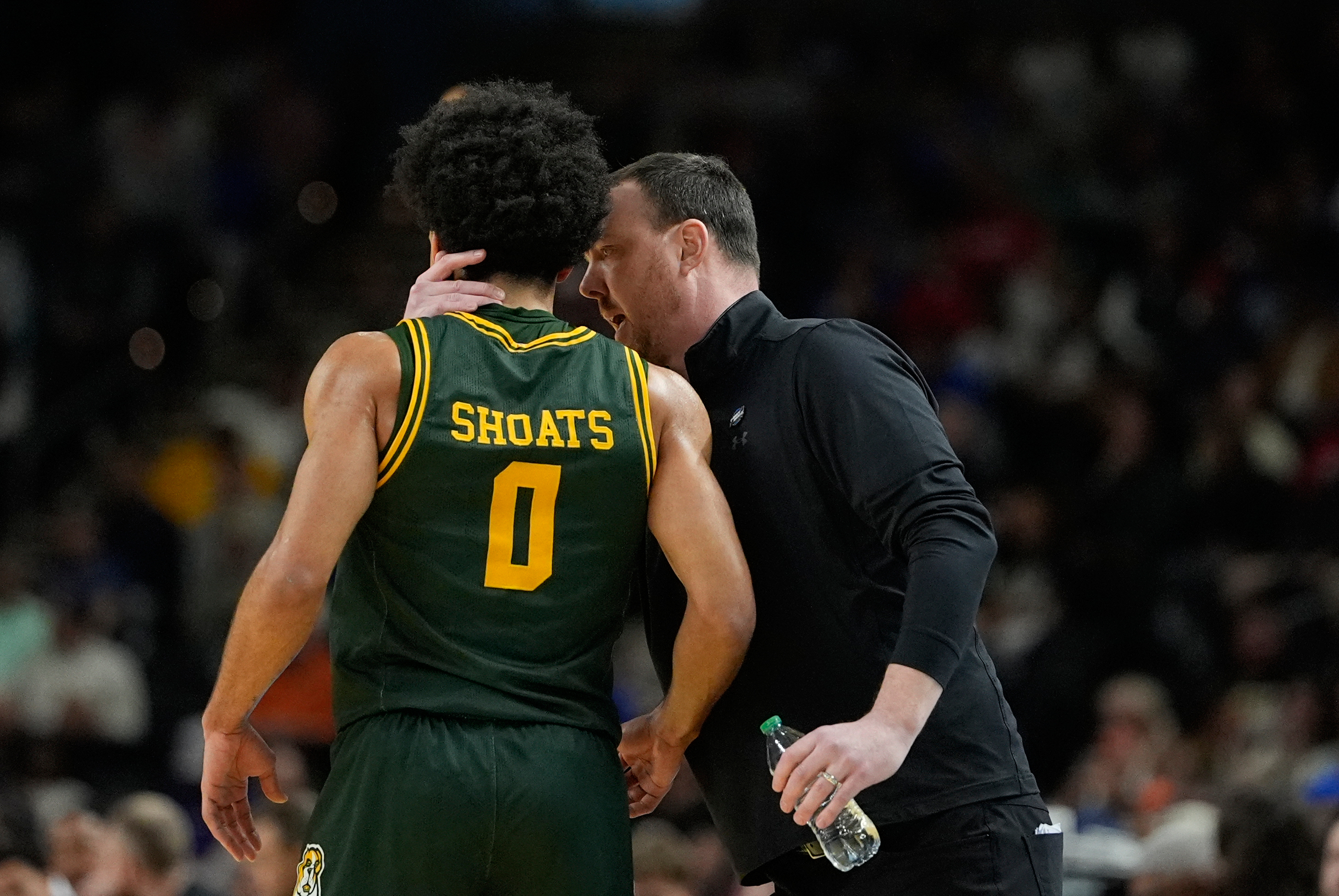 Siena head coach Gerry McNamara talks with Siena guard Justice...