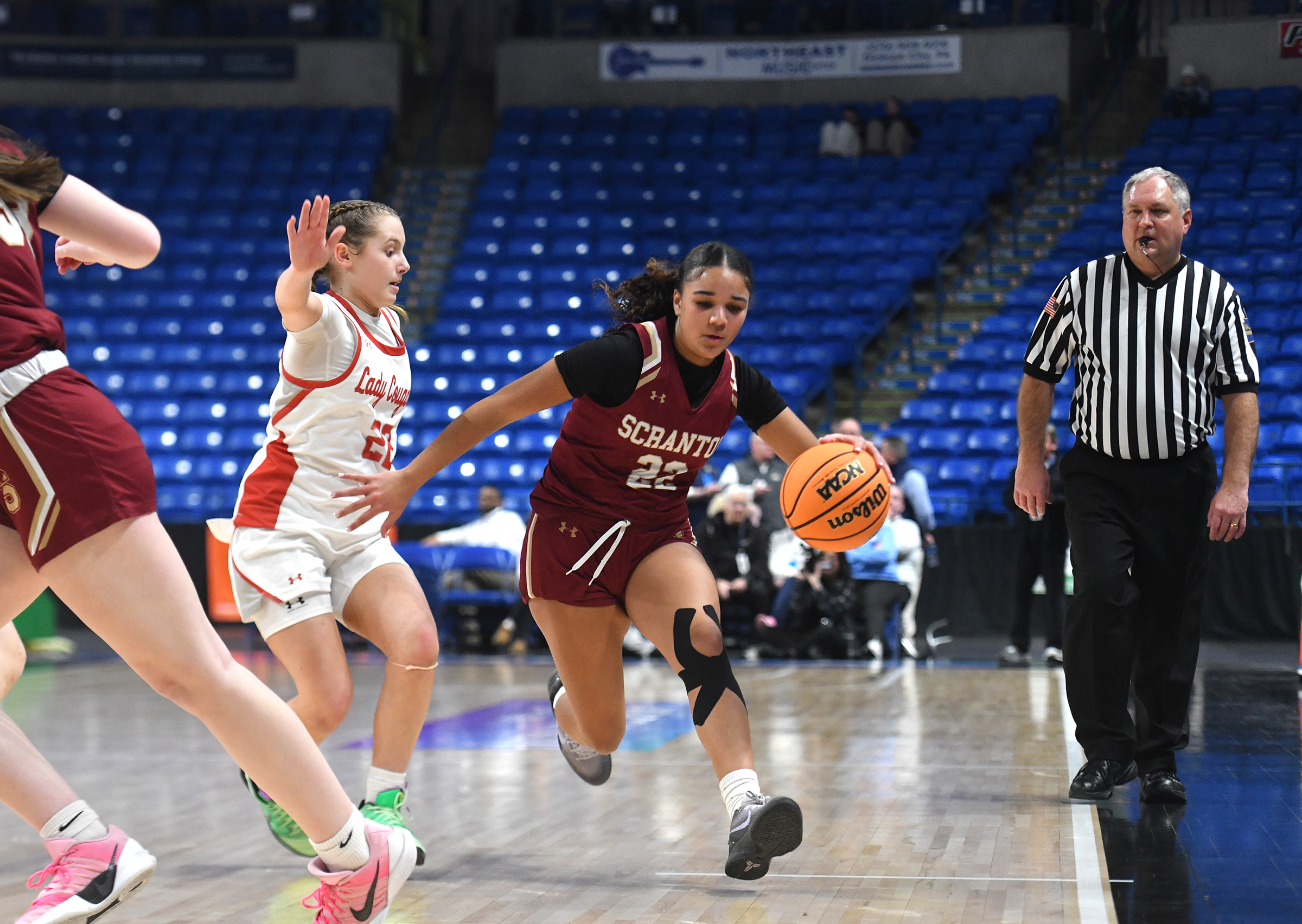 Scranton’s Jaelyn Alers, right, controls the ball against the defense...