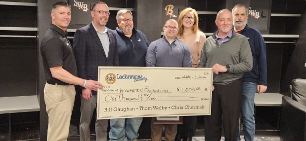 Lackawanna County presented the Bill Howerton K Cancer organization with a $1,000 check during the fourth annual Media Day for Lackawanna League baseball and softball teams. From left, North Pocono baseball coach and Howerton K Cancer founder Brian Jardine; Andrew Kettel, this year's recipient of the Howerton Exemplary Service Award; Lackawanna County Community Outreach Manager Rick Notari; Chris Szewczyk, Howerton's nephew; Maureen Howerton, Howerton's daughter; Lackawanna County Director for Community Relations Mark Cordelli; and Jamie Kane of the American Cancer Society.