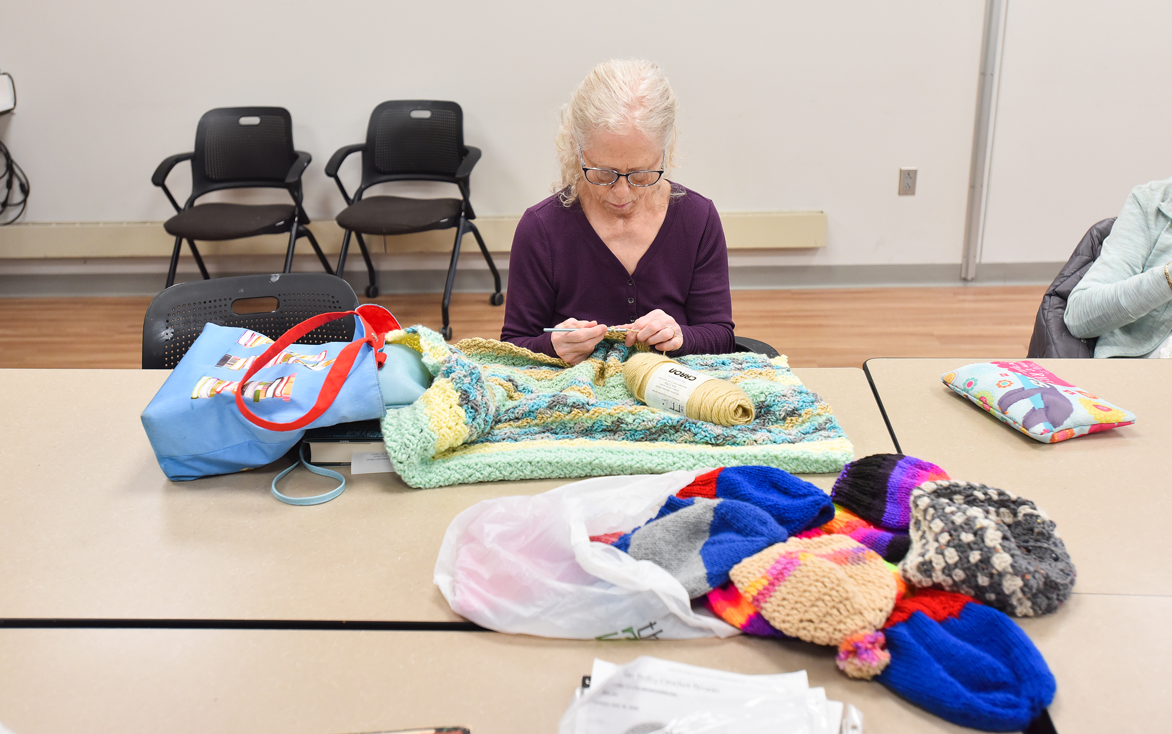 Sharleen Martin, of Clarks Summit, crochets with her group “Caring...