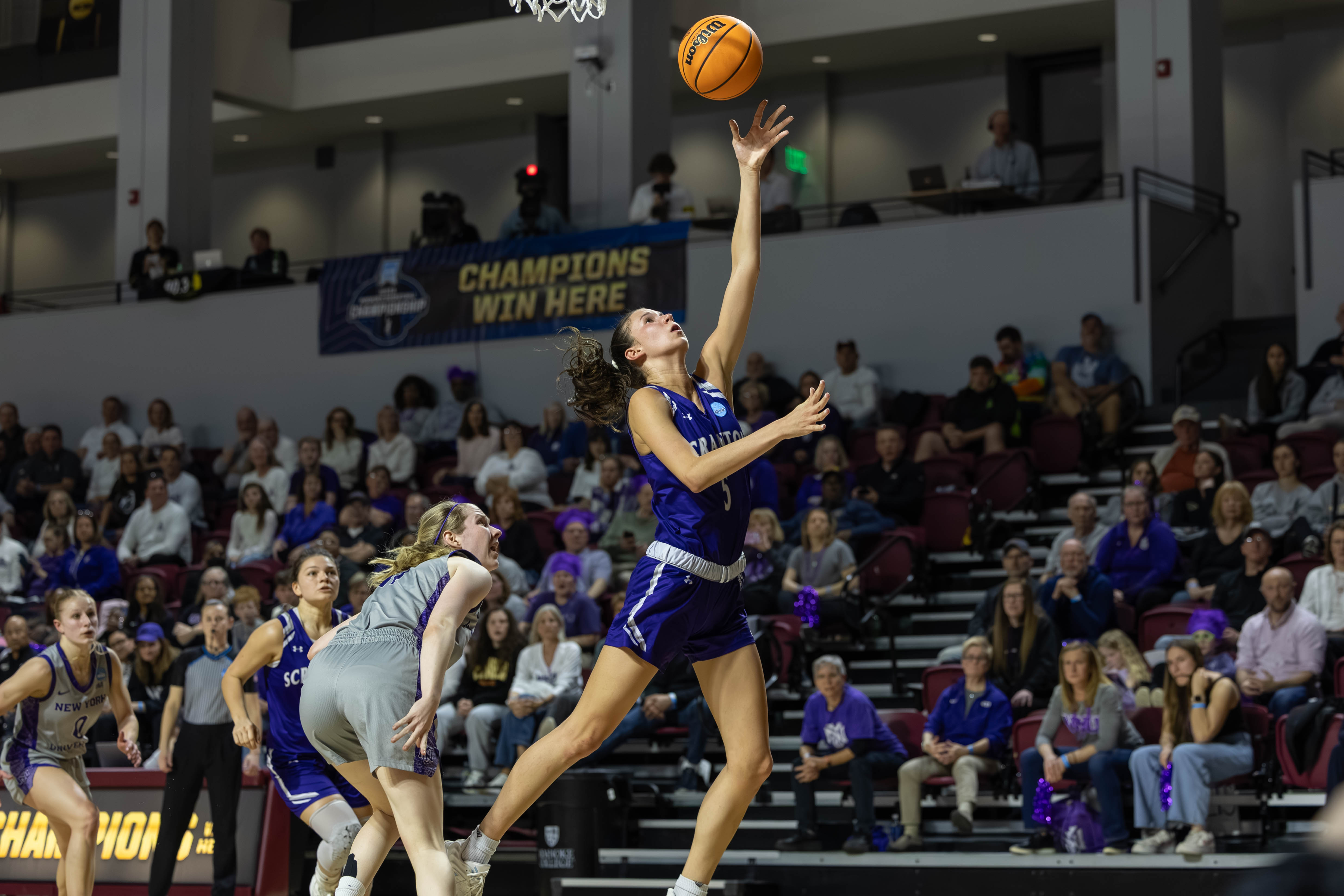 Katie Gorski of the University of Scranton goes in for...
