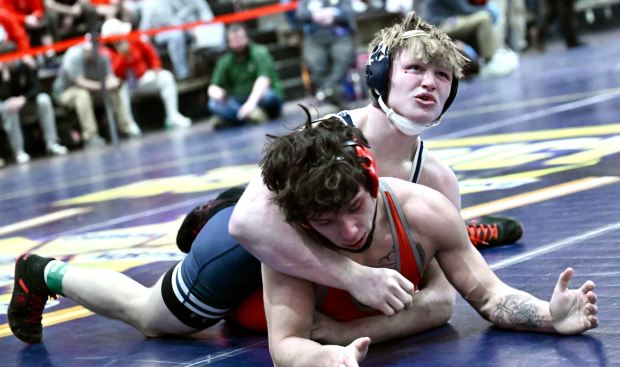 West Scranton's Tommy Schechterly, top, wrestles Parkland's Jorge Moya in the 160-pound quarterfinals at the Class 3A Northeast Regional on Friday at Liberty High School. BOB GAETANO / CONTRIBUTING PHOTOGRAPHER