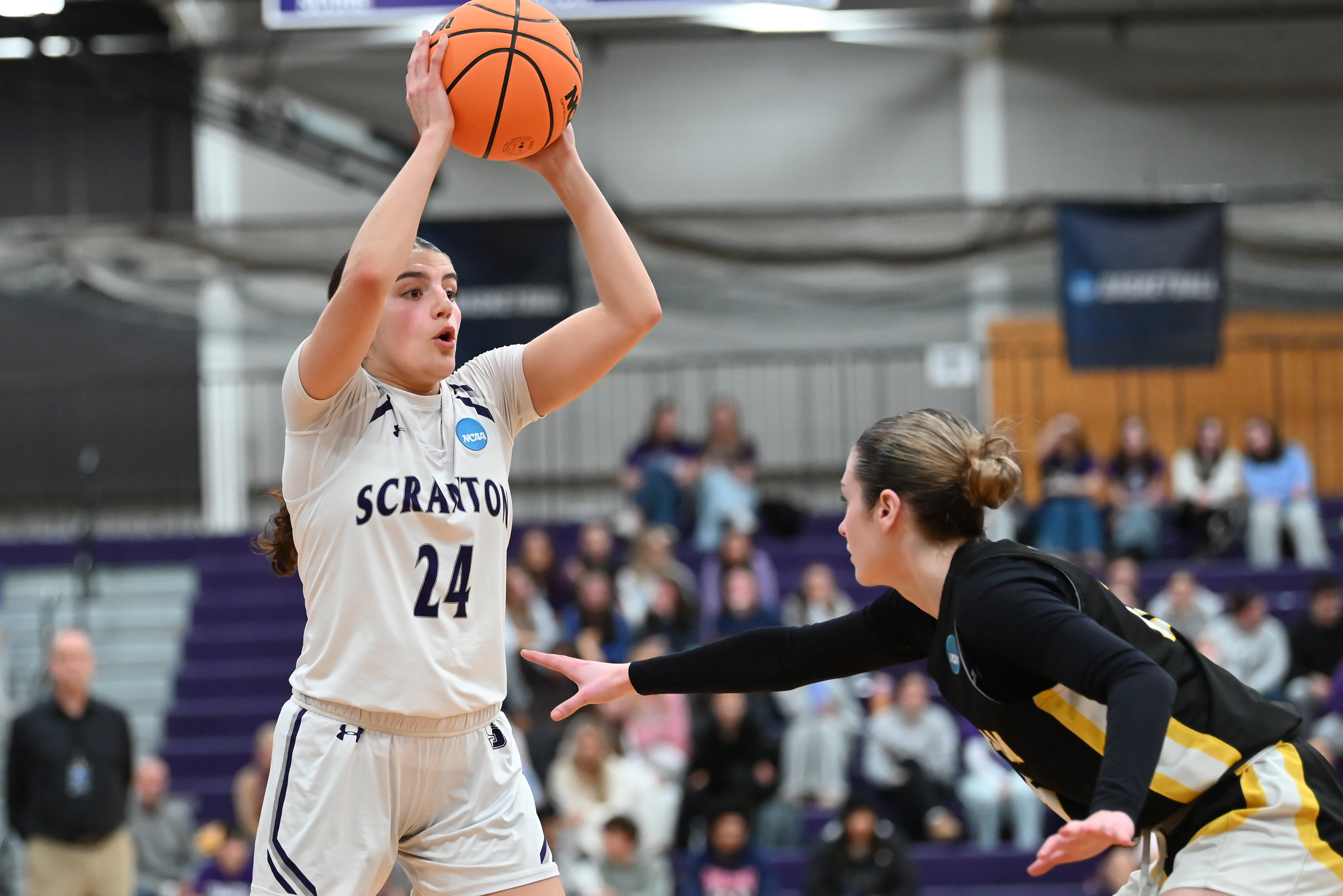 Framingham State’s Ava Mckeon defends University of Scranton’s Marisa Francione...