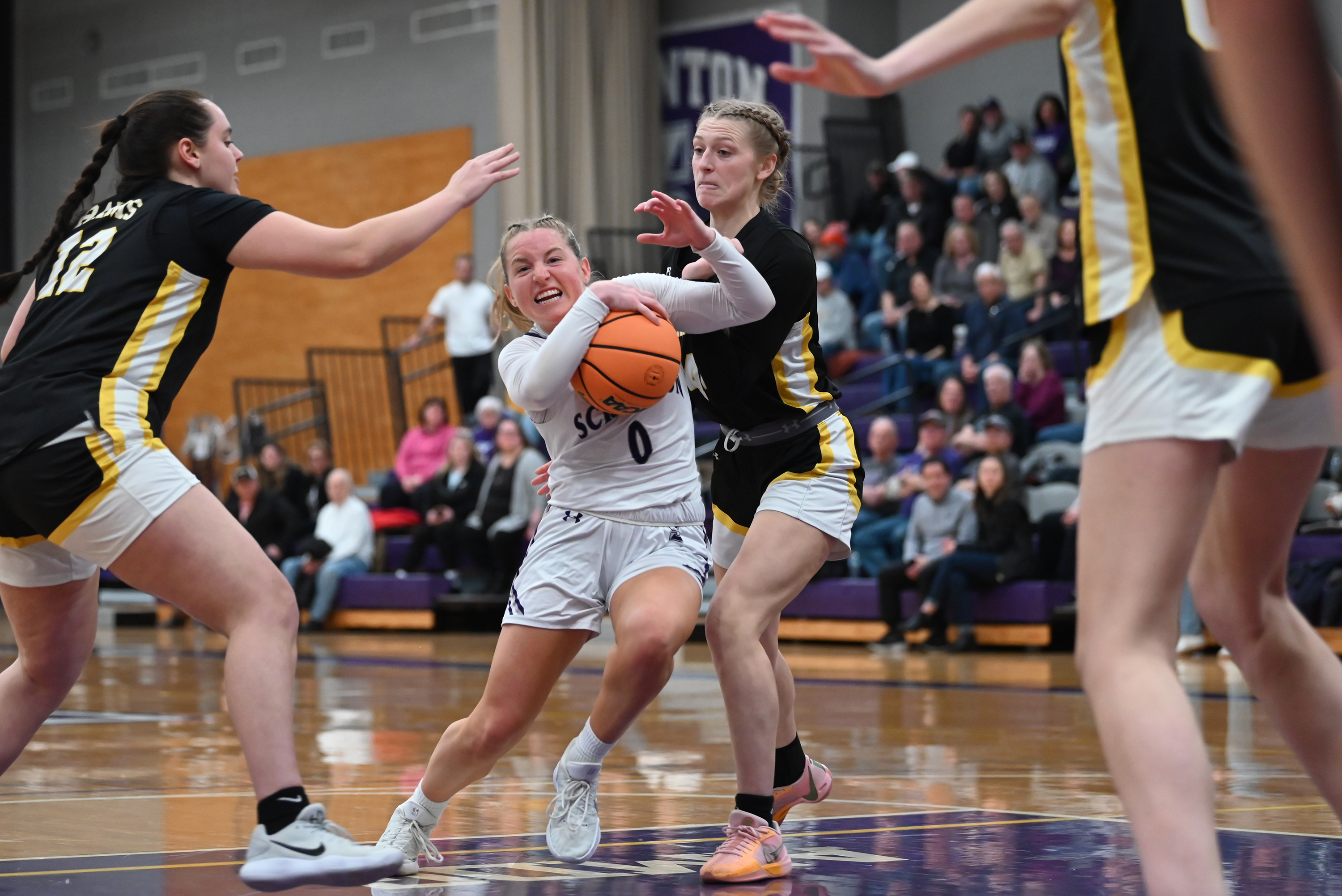Framingham State’s Evi Higgins and Hailey Ring defends University of...