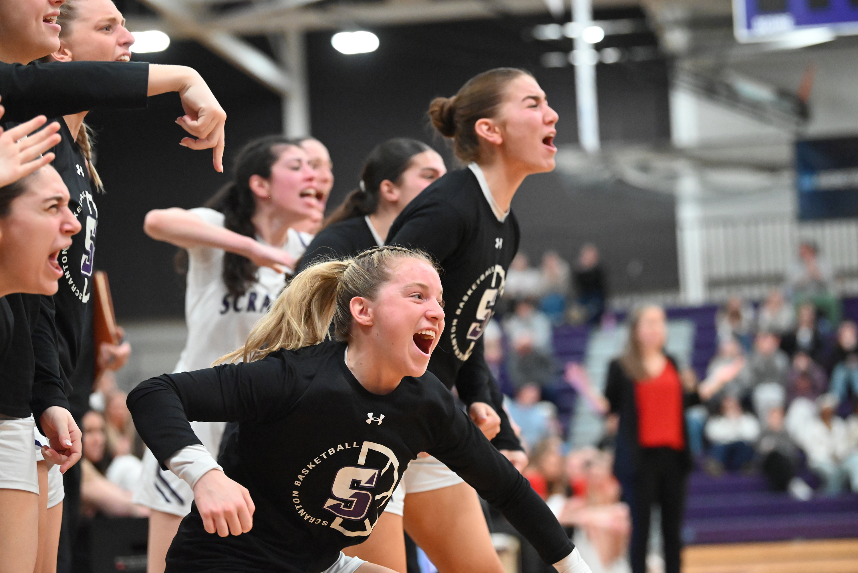 The Lady Royals’ bench celebrates after their teammates score against...