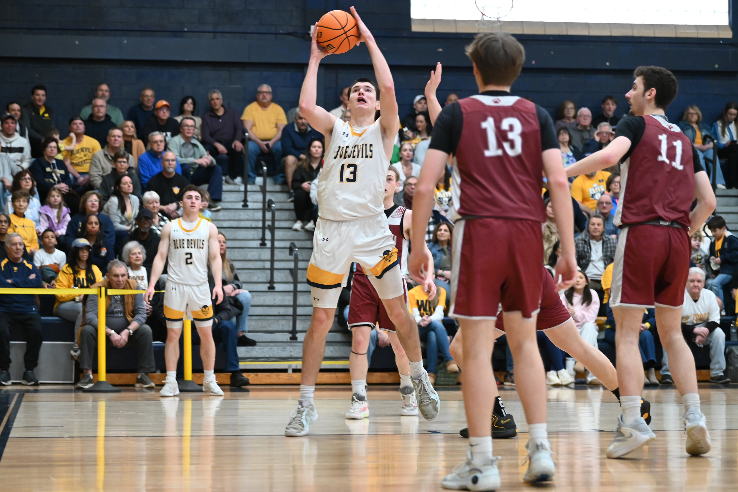 Old Forge’s Logan Fanning aims for the hoop during the...