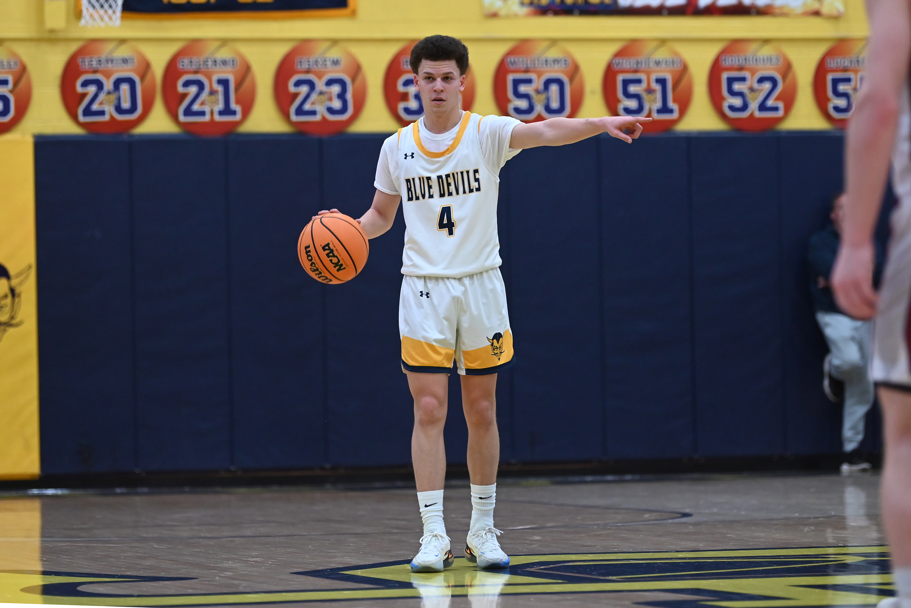 Old Forge’s Cameron Parker signals to his teammates during the...