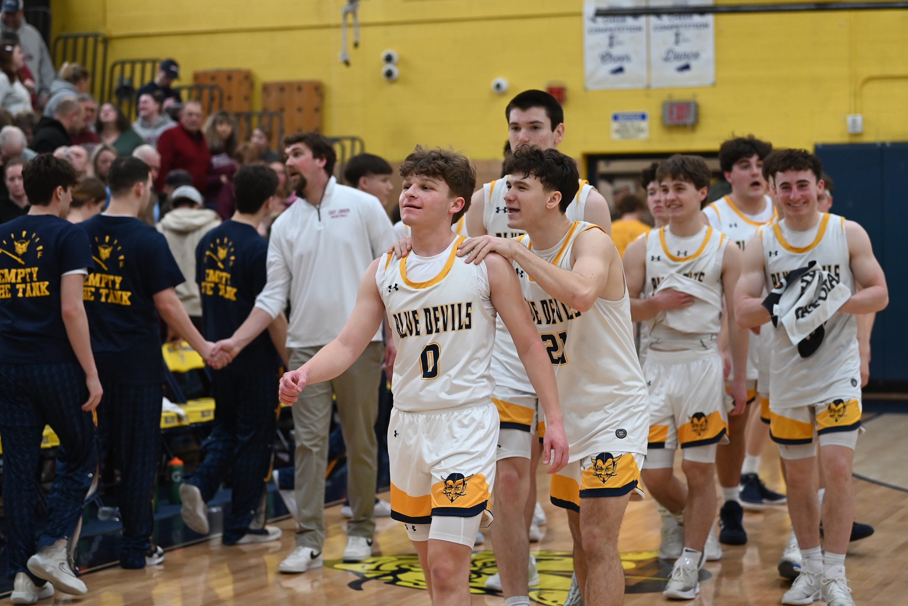 Old Forge players walk to the locker room after defeating...