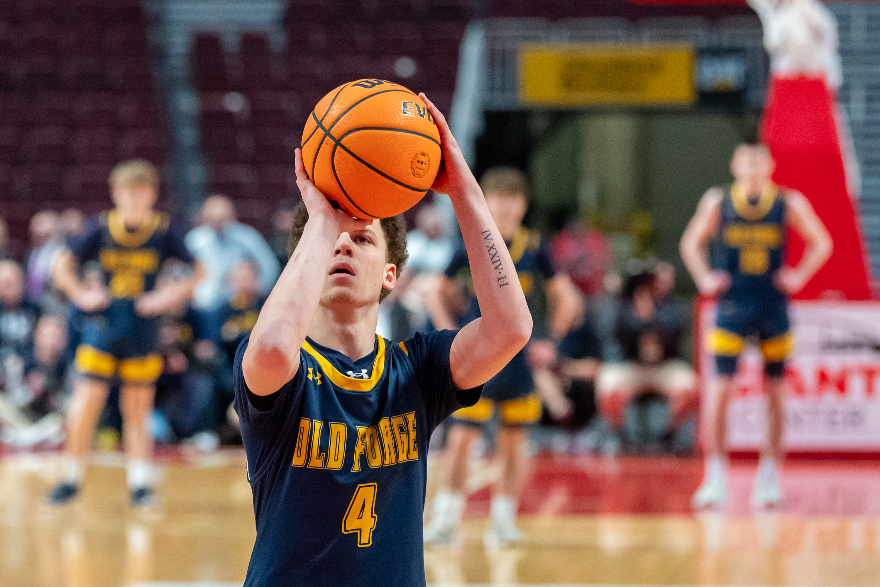 Old Forge’s Cameron Parker takes a free throw shot during...