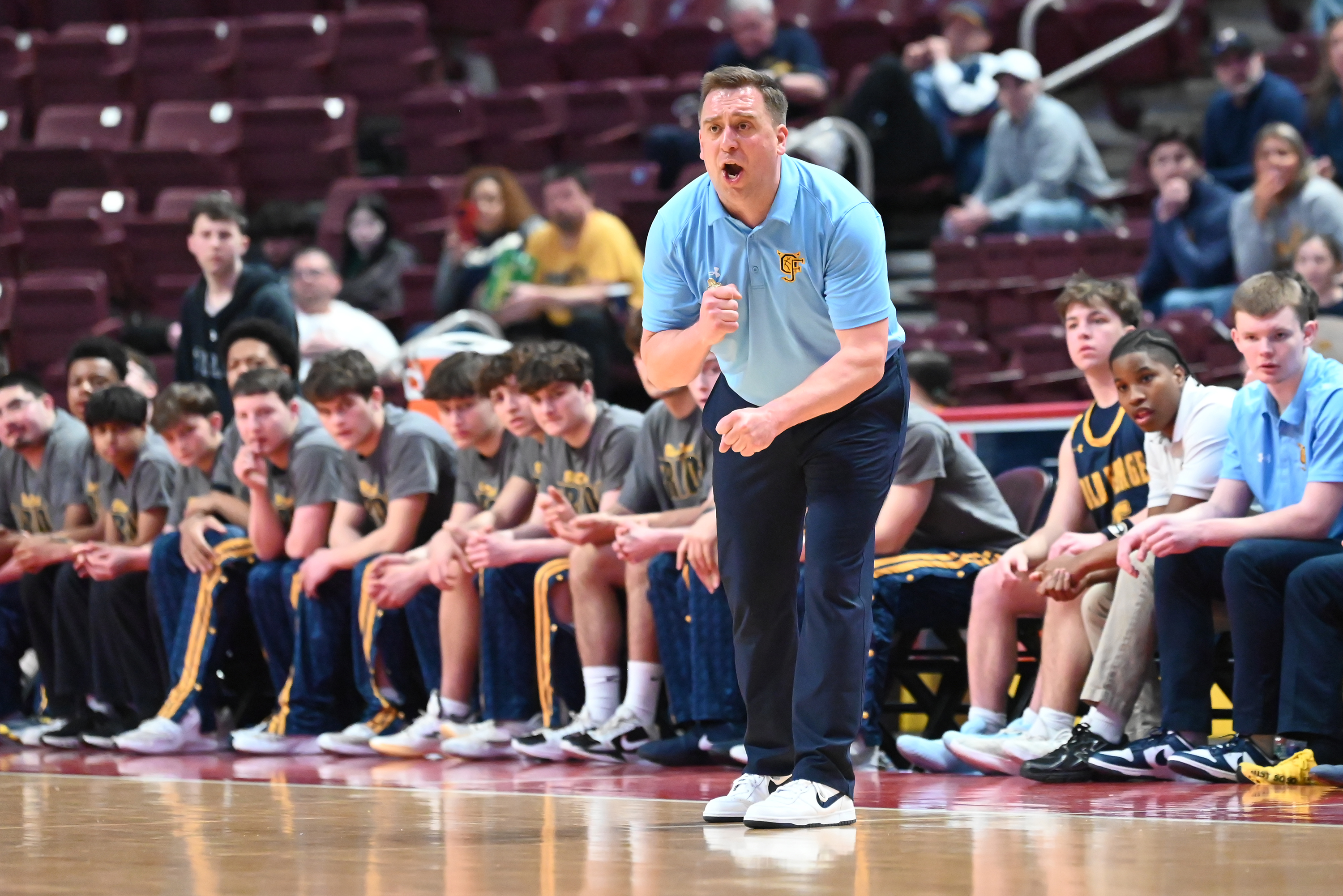 Old Forge’s head coach JJ Thomas calls out to his...