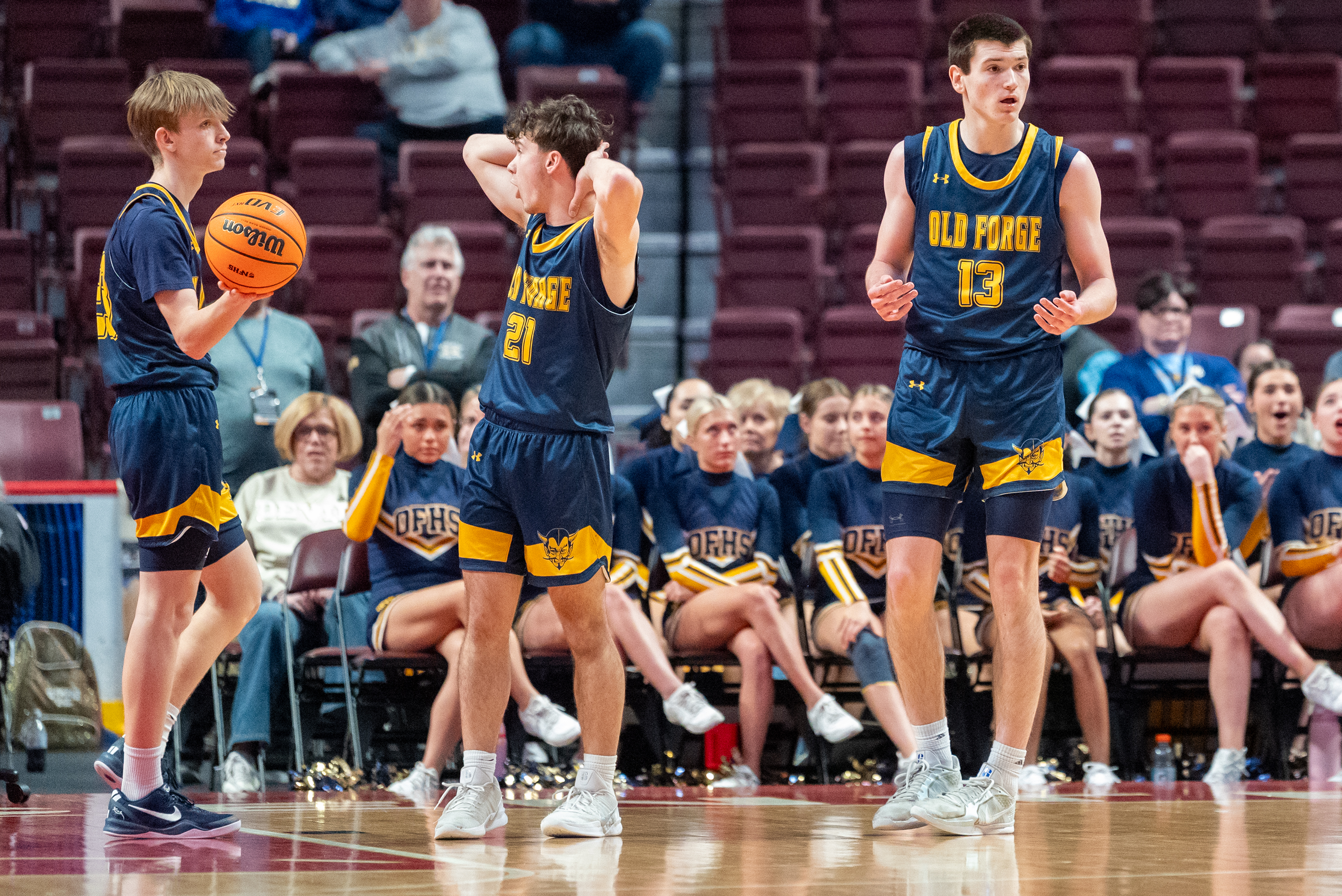 Old Forge players react to the referee’s call during the...
