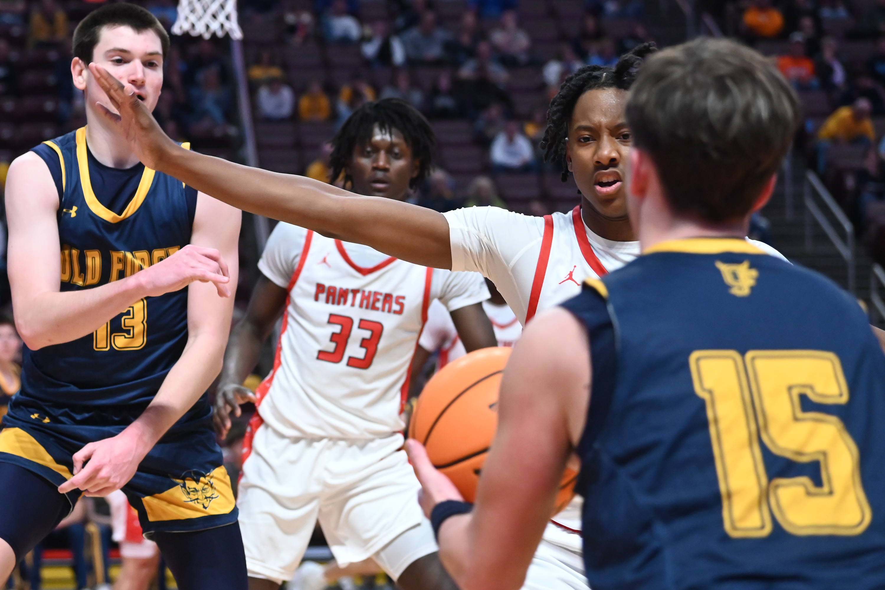 Old Forge’s Logan Fanning passes the ball to his teammate...