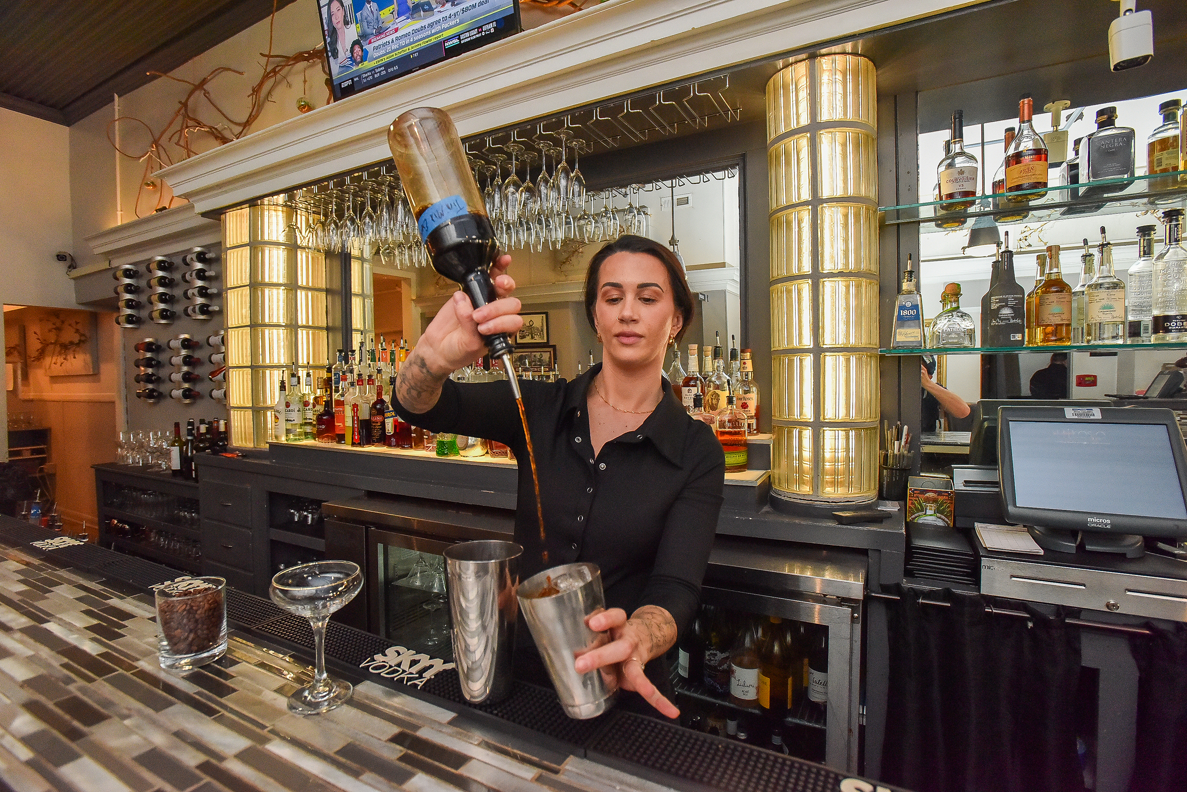 Bartender Jenna DiSabatino makes an espresso martini at Rikasa in...