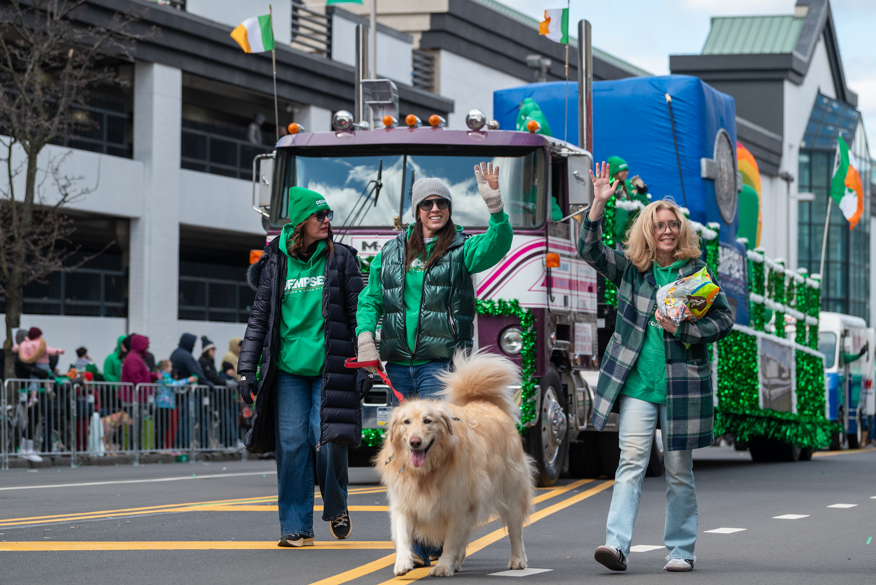 A dog walks with the Dempsey parade entry during the...
